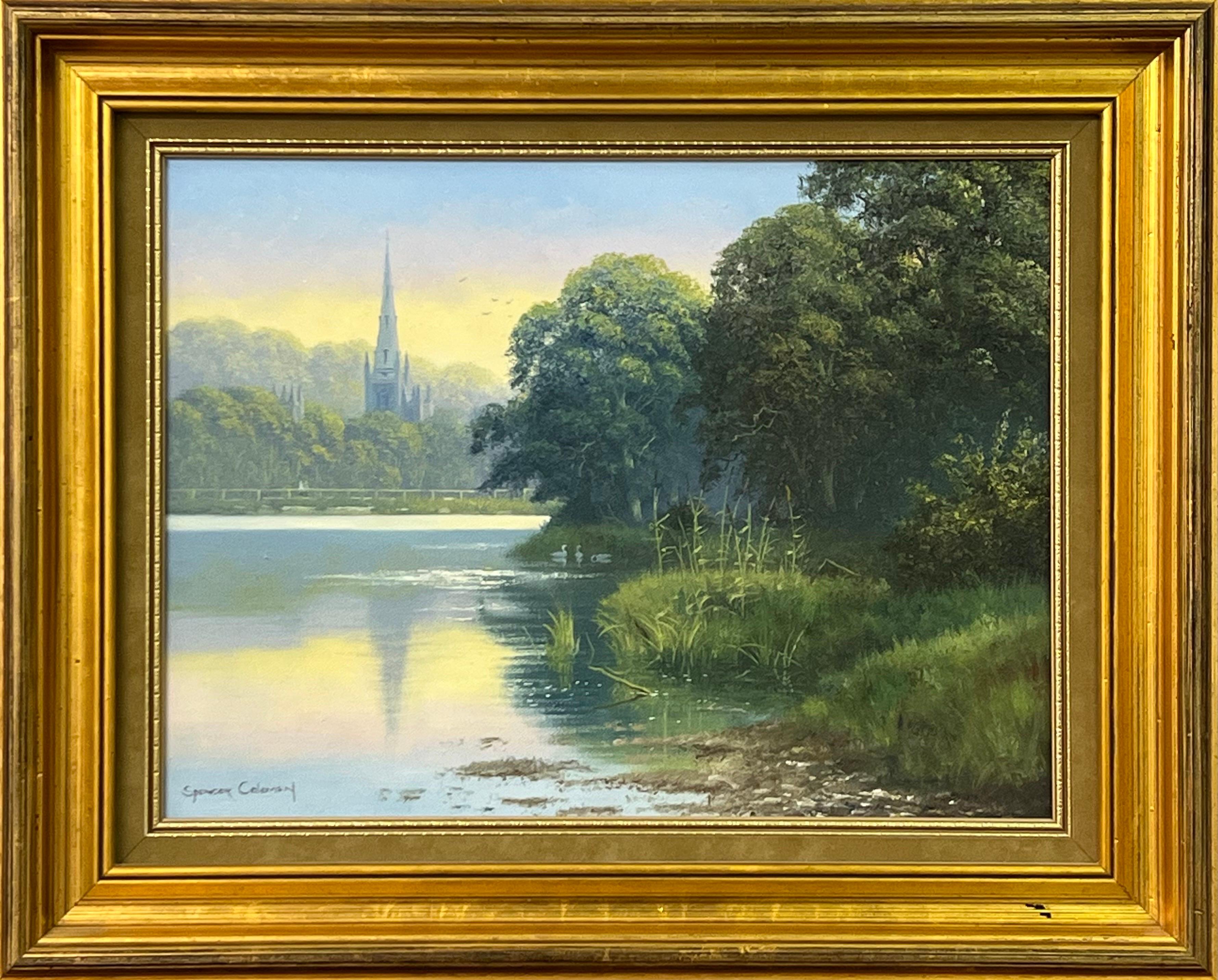 Peinture d'une scène de campagne irlandaise avec le lac des cygnes et les reflets d'une église - Territoire Painting par Spencer Coleman