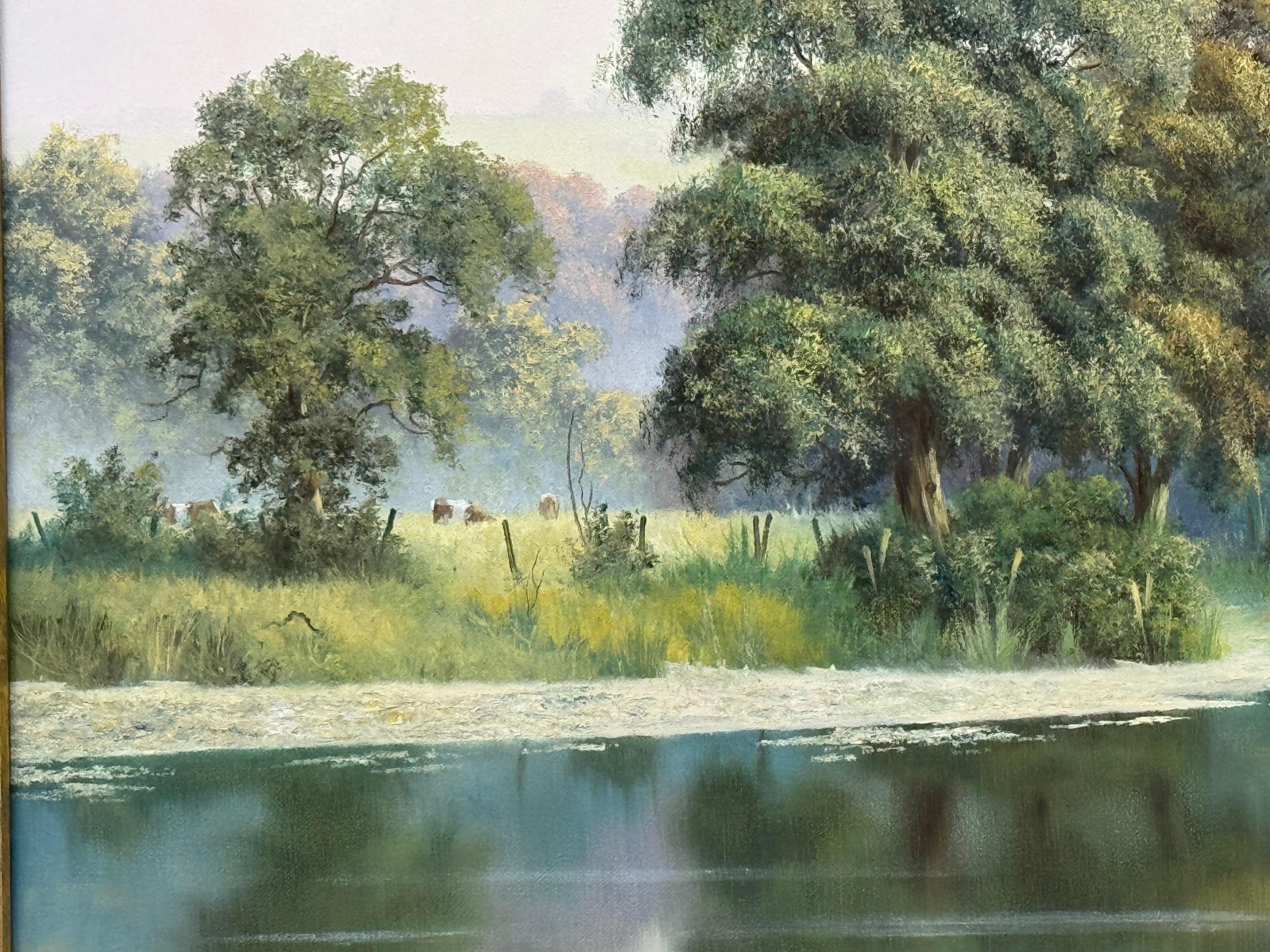 Apacible ribera brumosa en la campiña inglesa con vacas y reflejos de árboles en venta 7