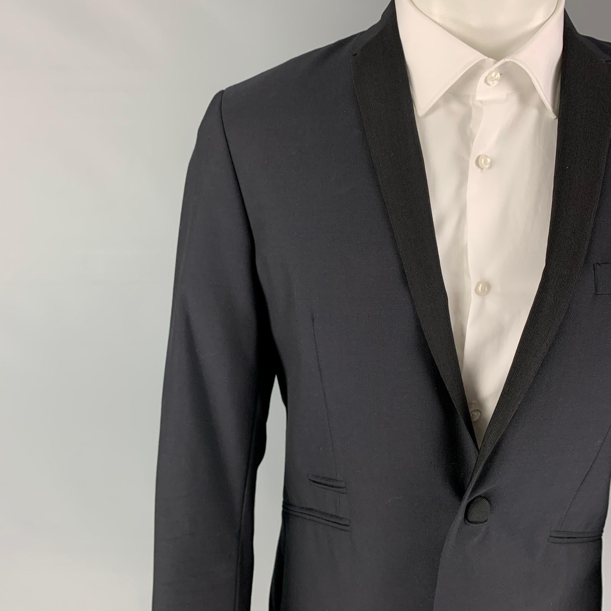 SPENCER HART sport coat comes in a navy wool / mohair with a full liner featuring a notch lapel, black trim, slit pockets, single back vent, and a single button closure. 

Excellent Pre-Owned Condition.
Marked: 38

Measurements:

Shoulder: 17.5