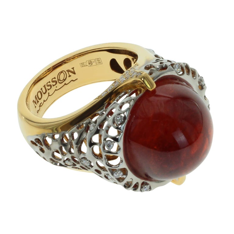 Spessartine Garnet Caboсhon Diamonds 18 Karat Yellow White Gold Ring
Delicate combination of white and yellow 18K gold set off the diamonds shining, at the same time emphasise the saturation of Spessartin Garnet.
Ring charms with an unusual piercing