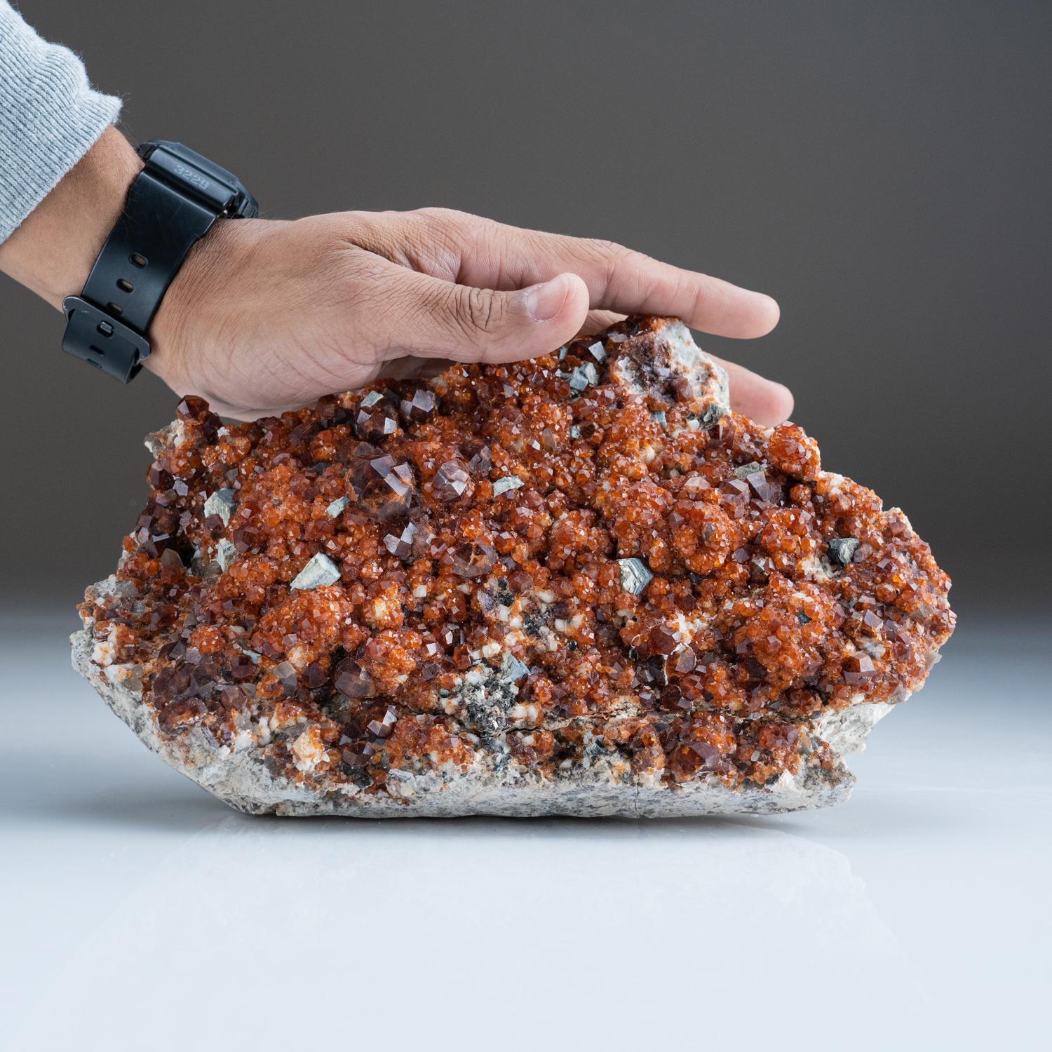 From Tongbei-Yunling District, Fujian Province, China

Translucent dark-red orange spessartine garnets on albite matrix with lustrous  translucent smoky quartz crystal cluster. The garnets are lustrous fully terminated in classic dodecahedron form