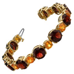 Spessartite and Red Garnet Tennis Bracelet, 54.87 Carats Total in Yellow Gold