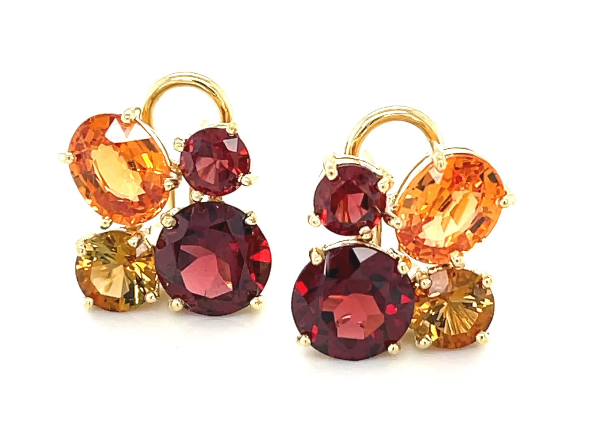 These gorgeous gemstone earrings feature two colorful varieties of rich garnets combined with bright, sparkling citrines in 18k yellow gold. The large oval spessartine garnets have stunning tangerine orange color and weigh 5.16 carats total. Round,
