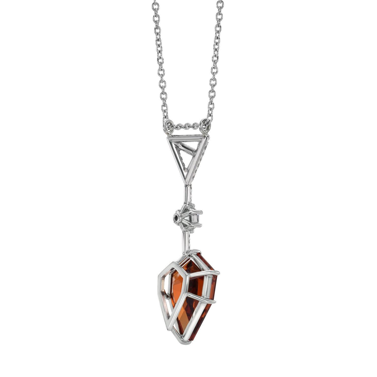 Remarkable 7.39 carat fancy Shield Spessartite Garnet, suspending from a 0.27 carat E/VS1 diamond hexagon, and a three dimensional, signature Merkaba triangle, set with a total of 0.22 carats of single-cut collection diamonds. This exclusive