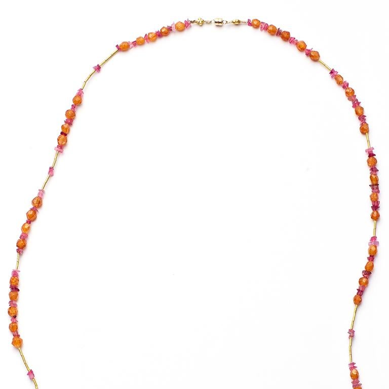 This vibrant, yet delicate necklace features gemstones of different cuts and hues and is perfect for adding a pop of color to any outfit.
