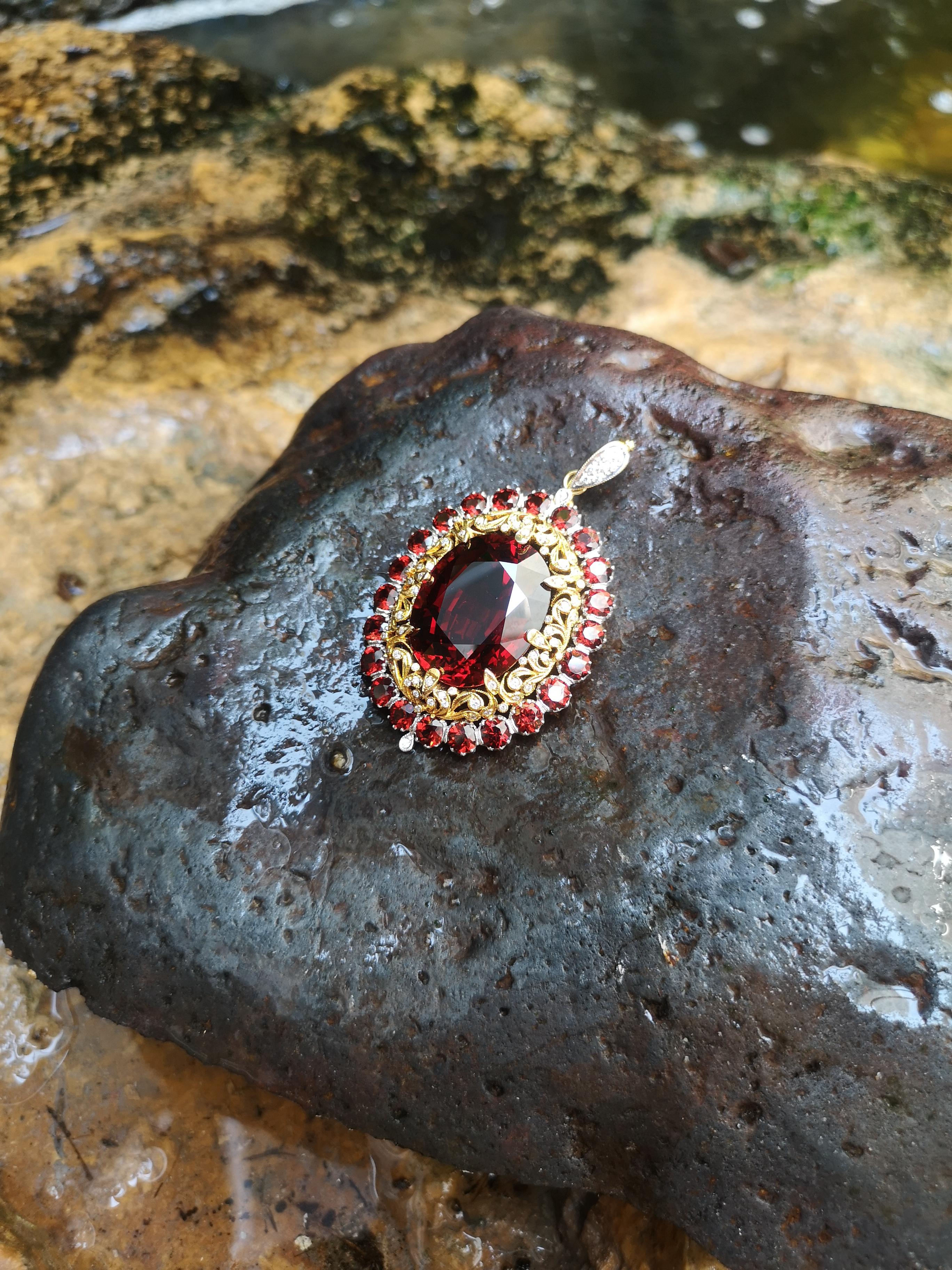 Spessartite Garnet 52.82 carats with Spessartite Garnet 9.81 carats and Diamond 0.63 carat Brooch set in 18 Karat White Gold Settings
(chain not included)

Width: 3.9 cm
Length: 6.0 cm 

