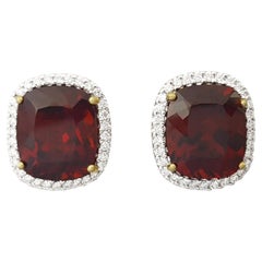 Orecchini con granato spessartite e diamanti con montatura in oro 18K