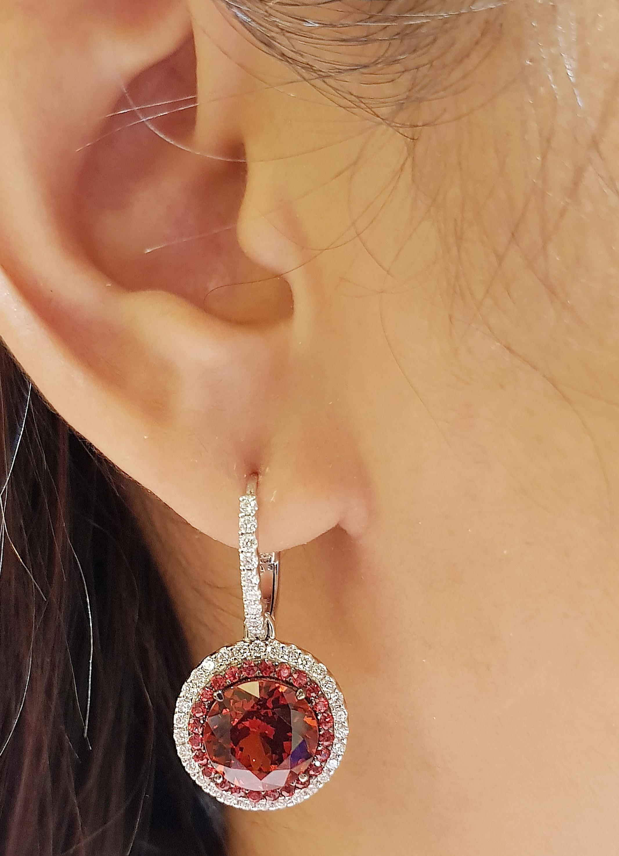 Spessartite Garnet 9.32 carats with Orange Sapphire 0.67 carat and Diamond 0.73 carat Earrings set in 18 Karat White Gold Settings

Width:  1.6 cm 
Length:  3.0 cm
Total Weight: 10.64 grams

