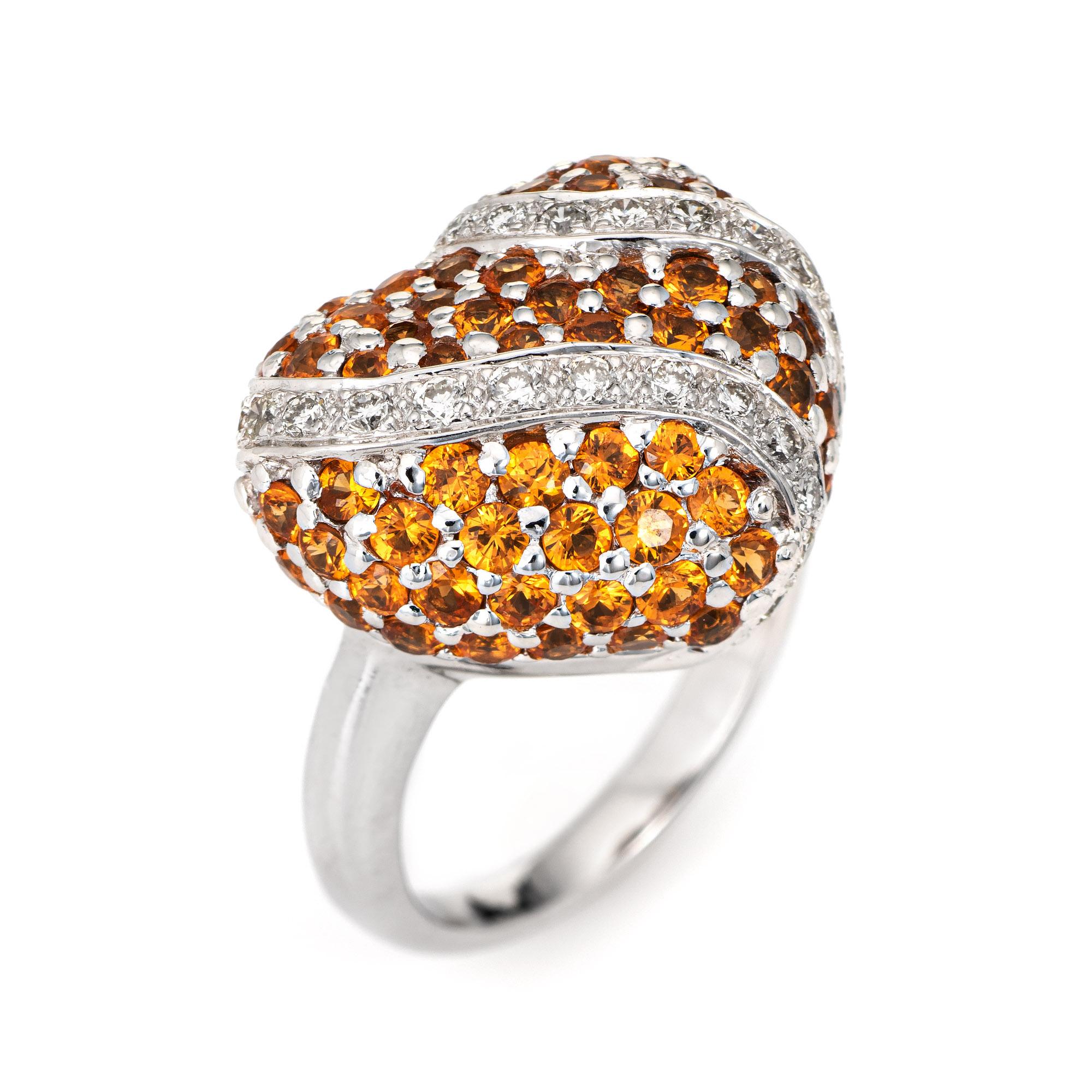 Stylish vintage Spessartite Orange Garnet heart cocktail ring crafted in 18 karat white gold. 

Spessartite orange garnets totaling an estimated 2.50 carats and a total of 0.28 carats of diamonds adorn the mount (estimated at G-H color and VS2