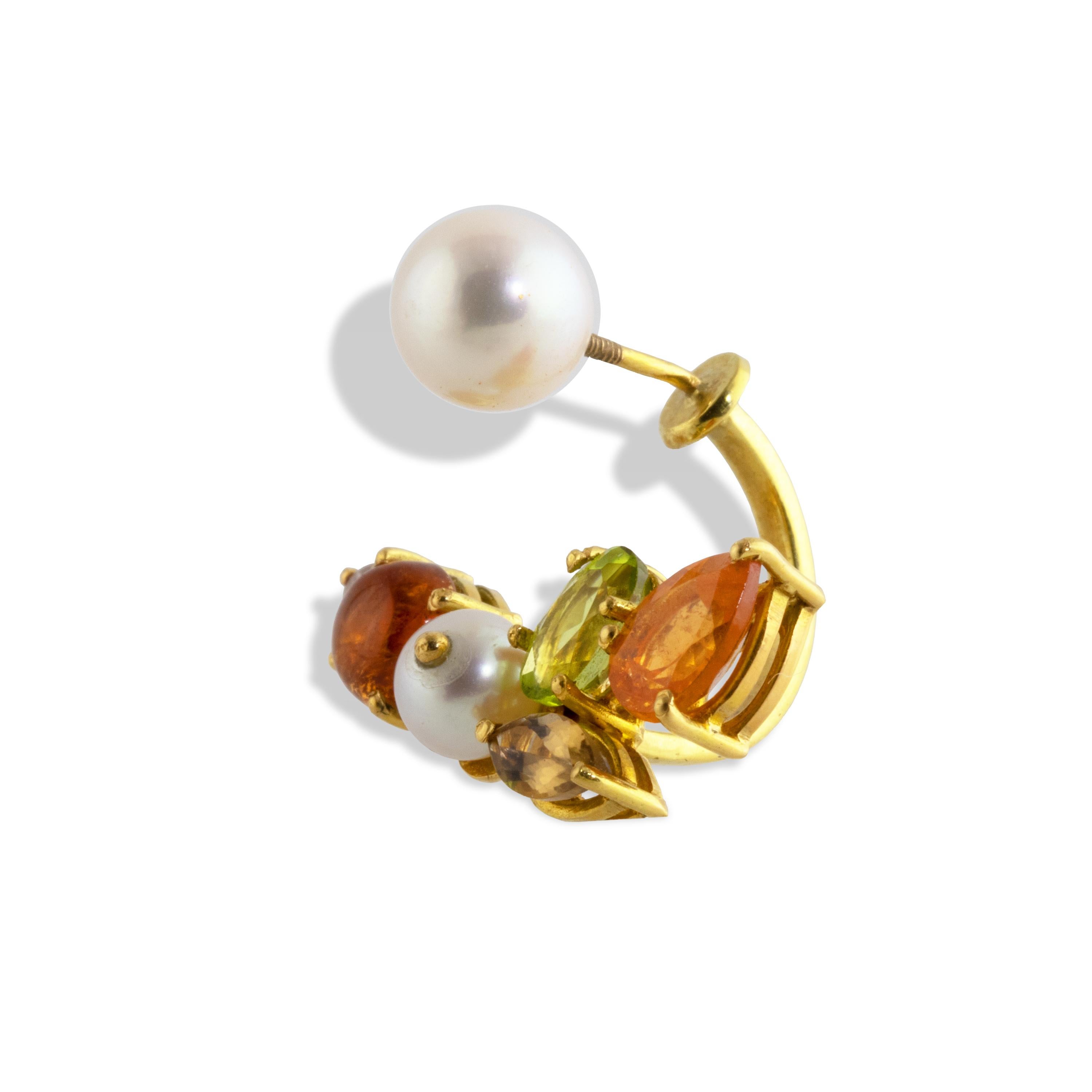 Golden colors of autumn are highlighted in this single 'flying' earring.
A cluster of Spessartite garnet, Citrine,  Morganite, Peridot, Diamond, and a Akoya Pearls, are set in 18k gold and curved to follow the edge of the ear for a dramatic, 