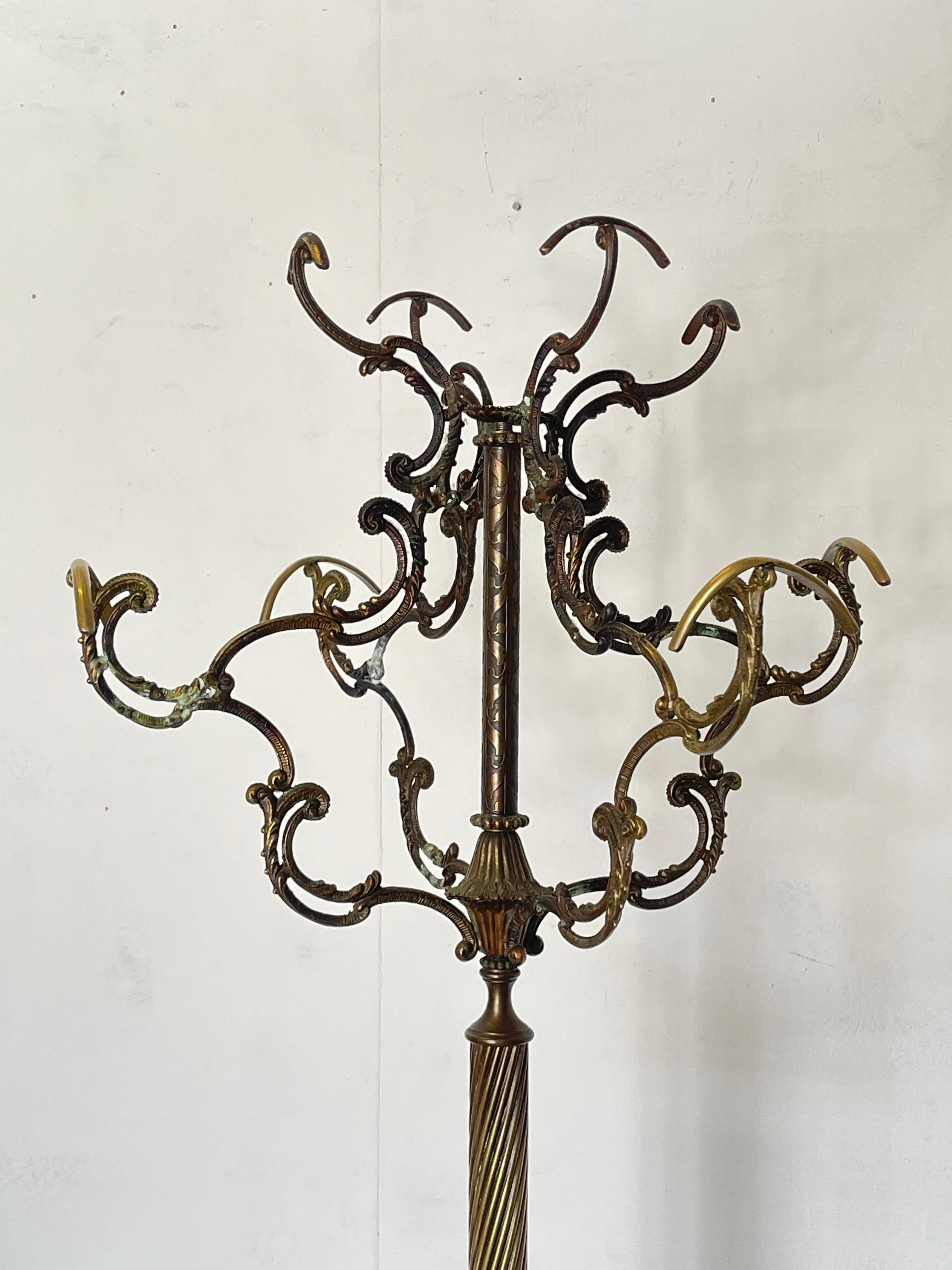 Italian Spectacular forged bronze coat rack with elegant details For Sale