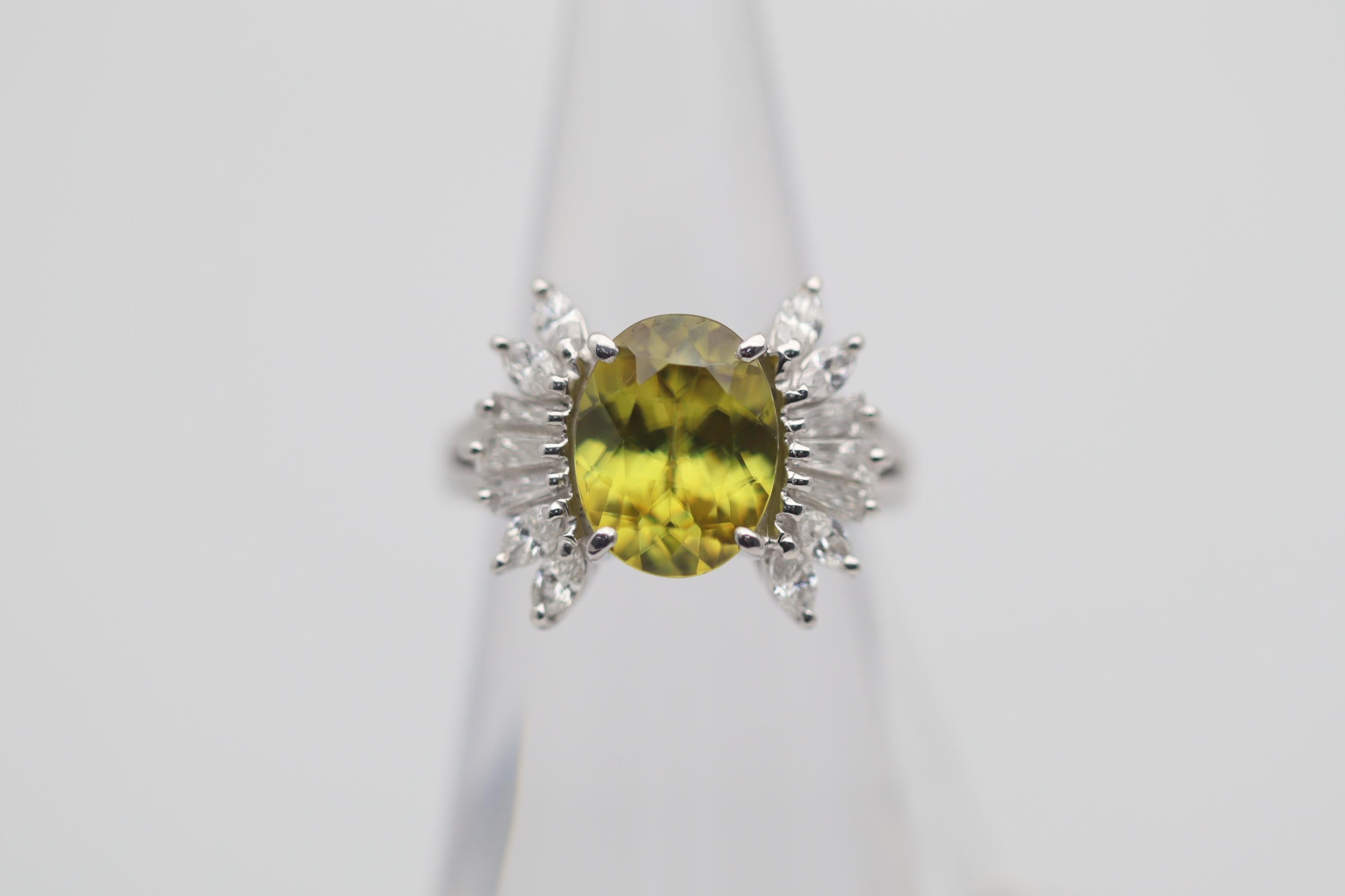 A lovely ring featuring a fine and unique gem, sphene! Sphene has a very high refractive index which gives the stone extremely high brilliance and fire. Various colors, including red, orange, green and yellow, can be seen scintillating across the