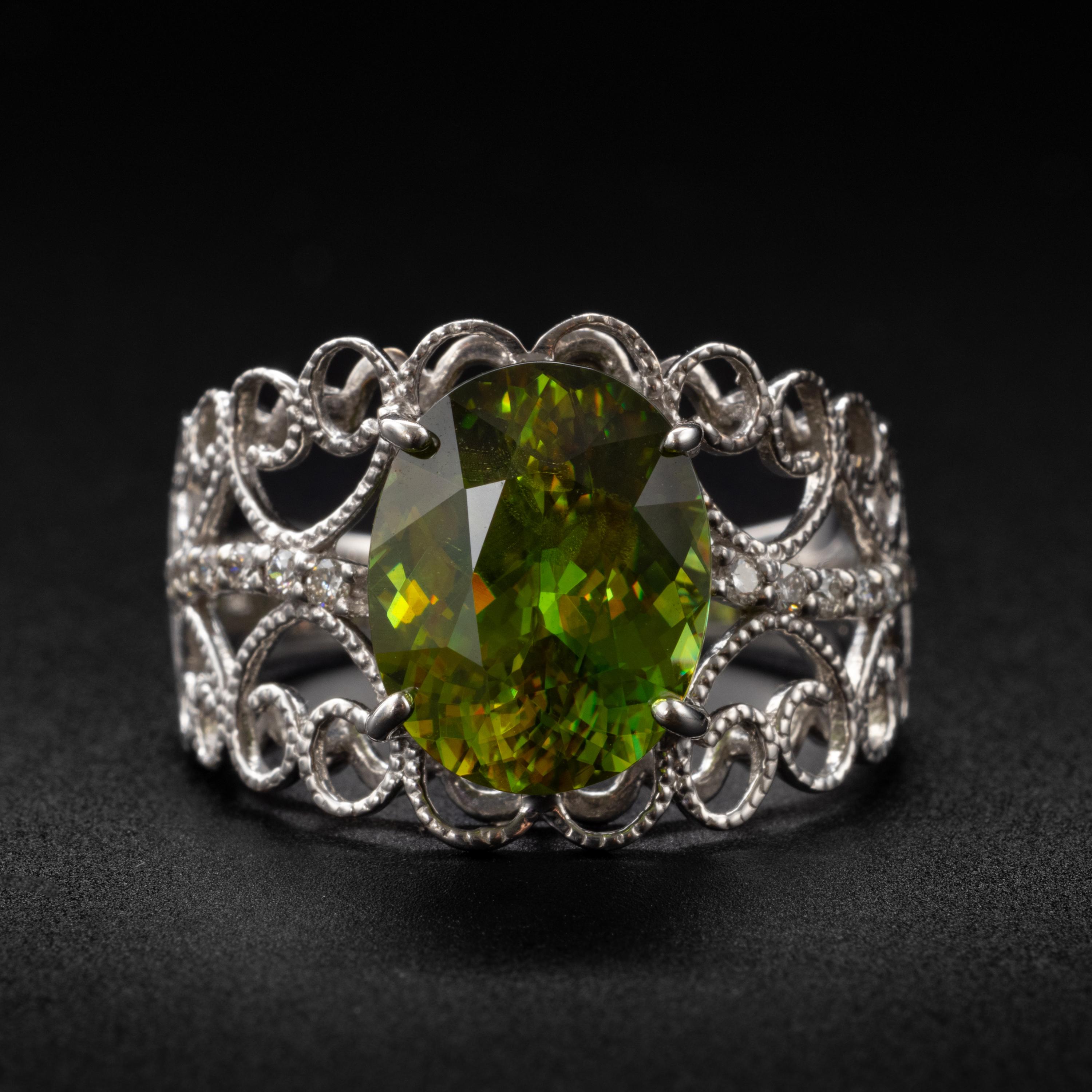 Behold a vivid chartreuse gemstone with more fire than a diamond and so rare you've probably never heard of, likely never seen, and almost certainly don't know anyone who owns one: sphene.  Also known as titanite. It's a favorite among gem