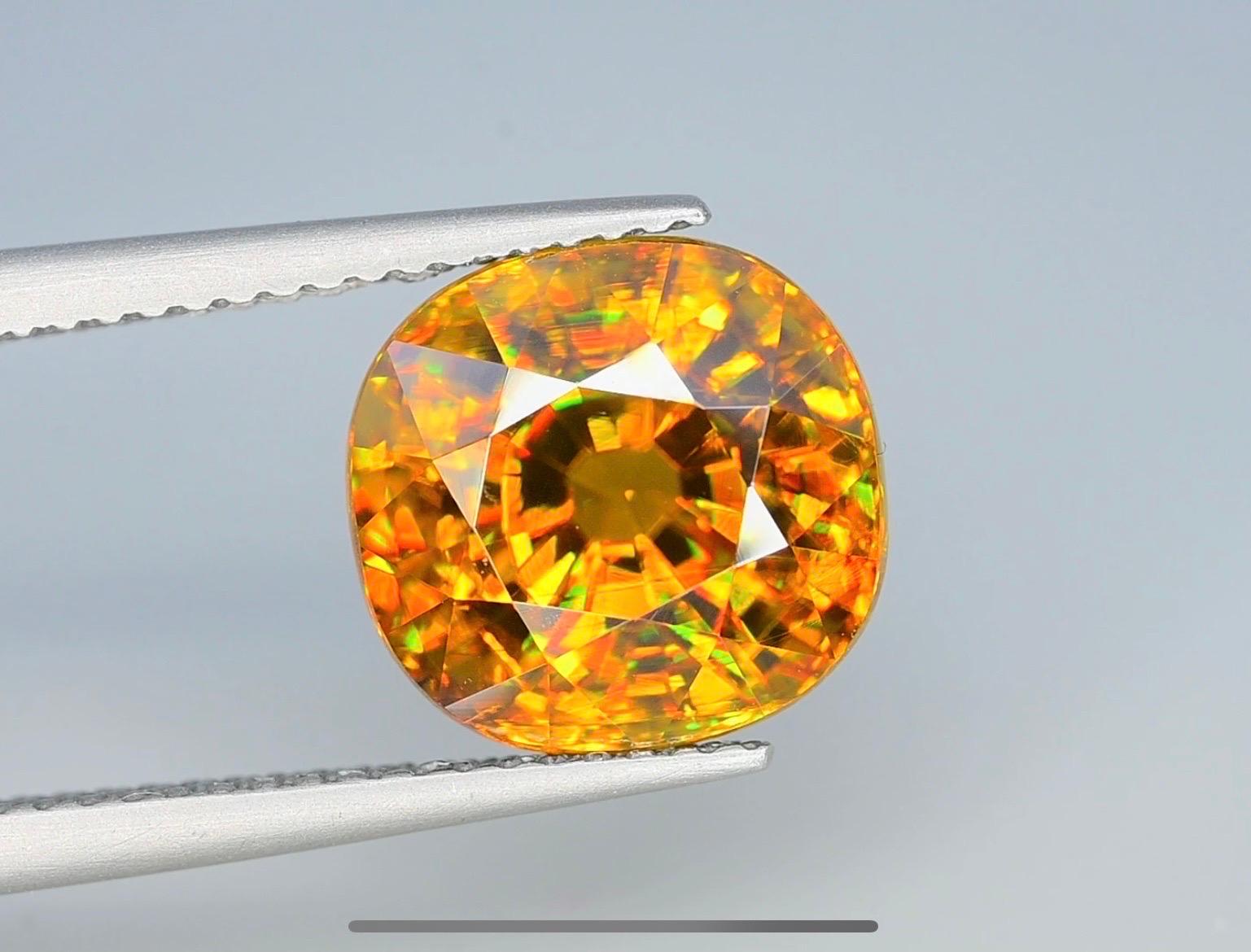 Introducing a stunning 6.6 carat VVS sphene titanite, radiating with a mesmerizing golden hue. Witness its breathtaking fire and remarkable clarity. A true embodiment of elegance and brilliance. Don’t miss the chance to own this exquisite