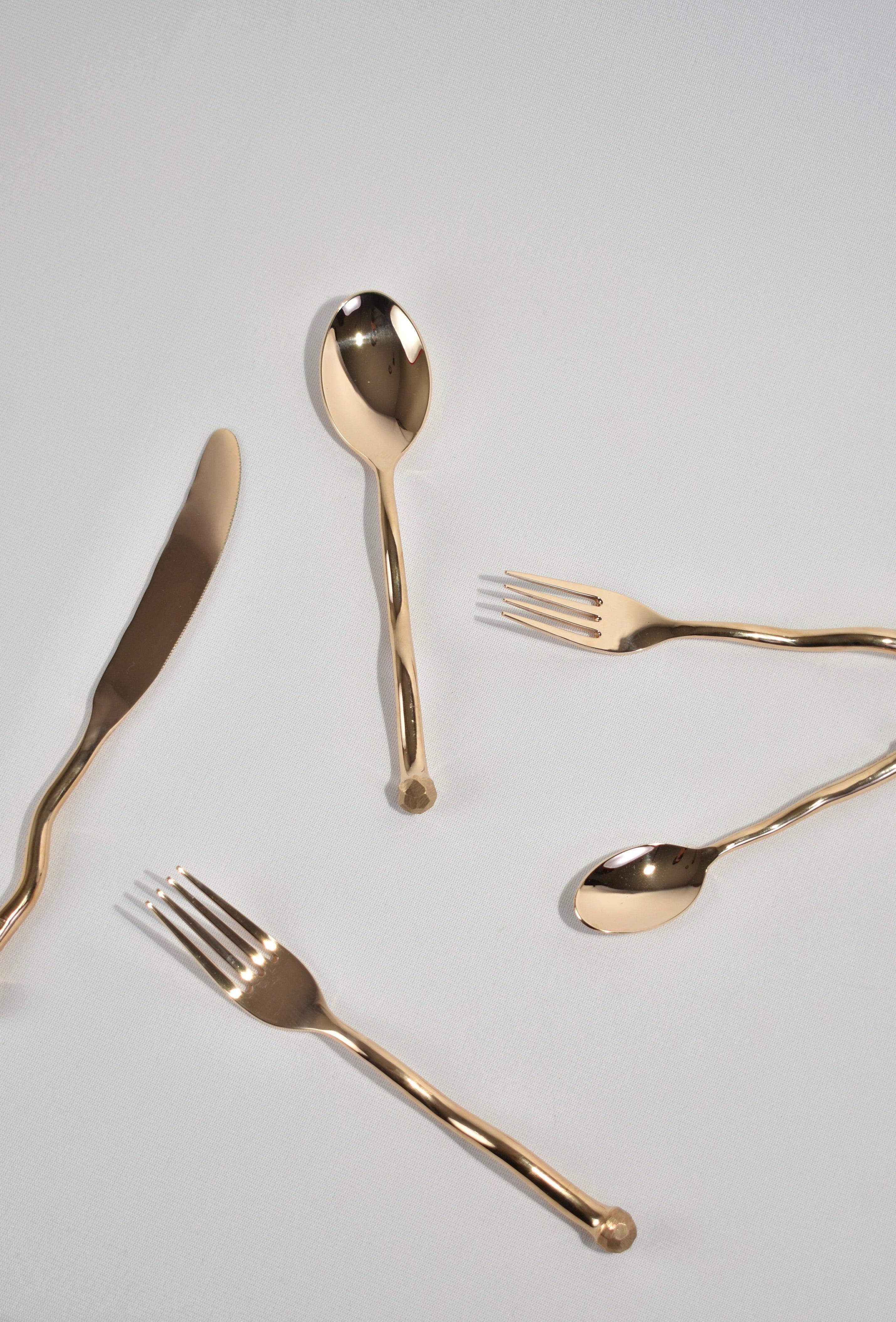 The re-issued 5 piece Sphere flatware set in bronze by Izabel Lam. Each piece features an undulating handle and hammered textured knob on end. Impressed above knob on underside of handle: 'IZABEL LAM'. 

Originally designed in the late 1980s by