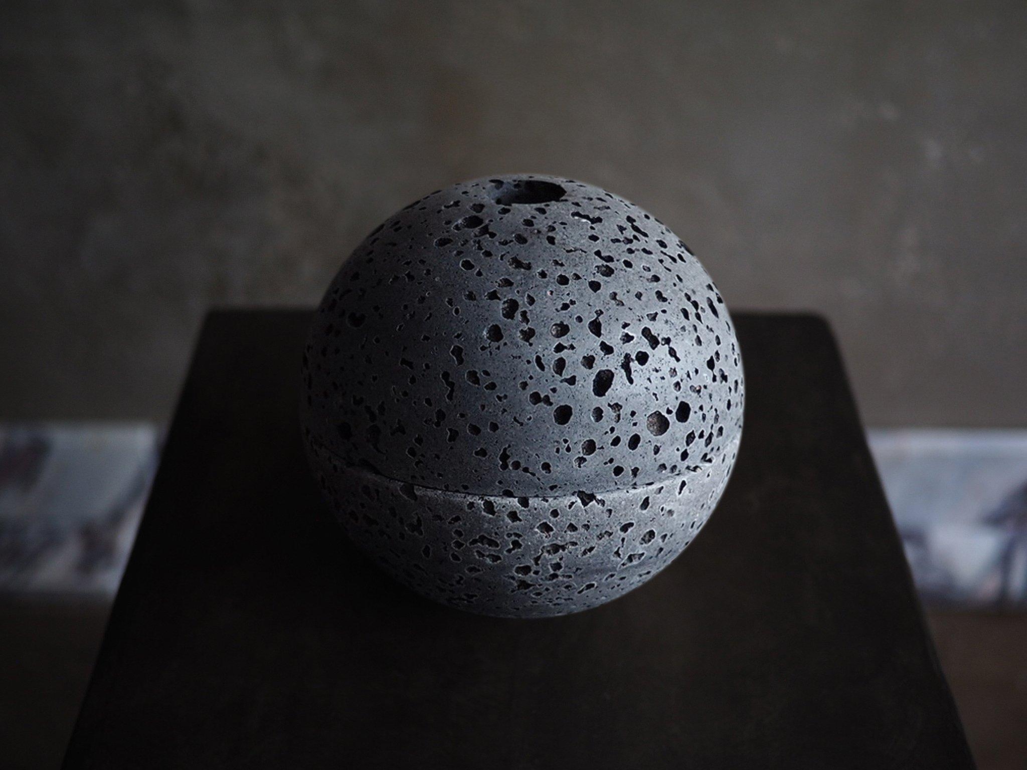 Sculpted from solid blocks of unfilled beige travertine, sphere censer by Brendan Tadler. Minimalist in form, the Sphere Censer acts as a quiet object to stimulate creativity and focus when activated with incense or sage. Inside the sphere, burn