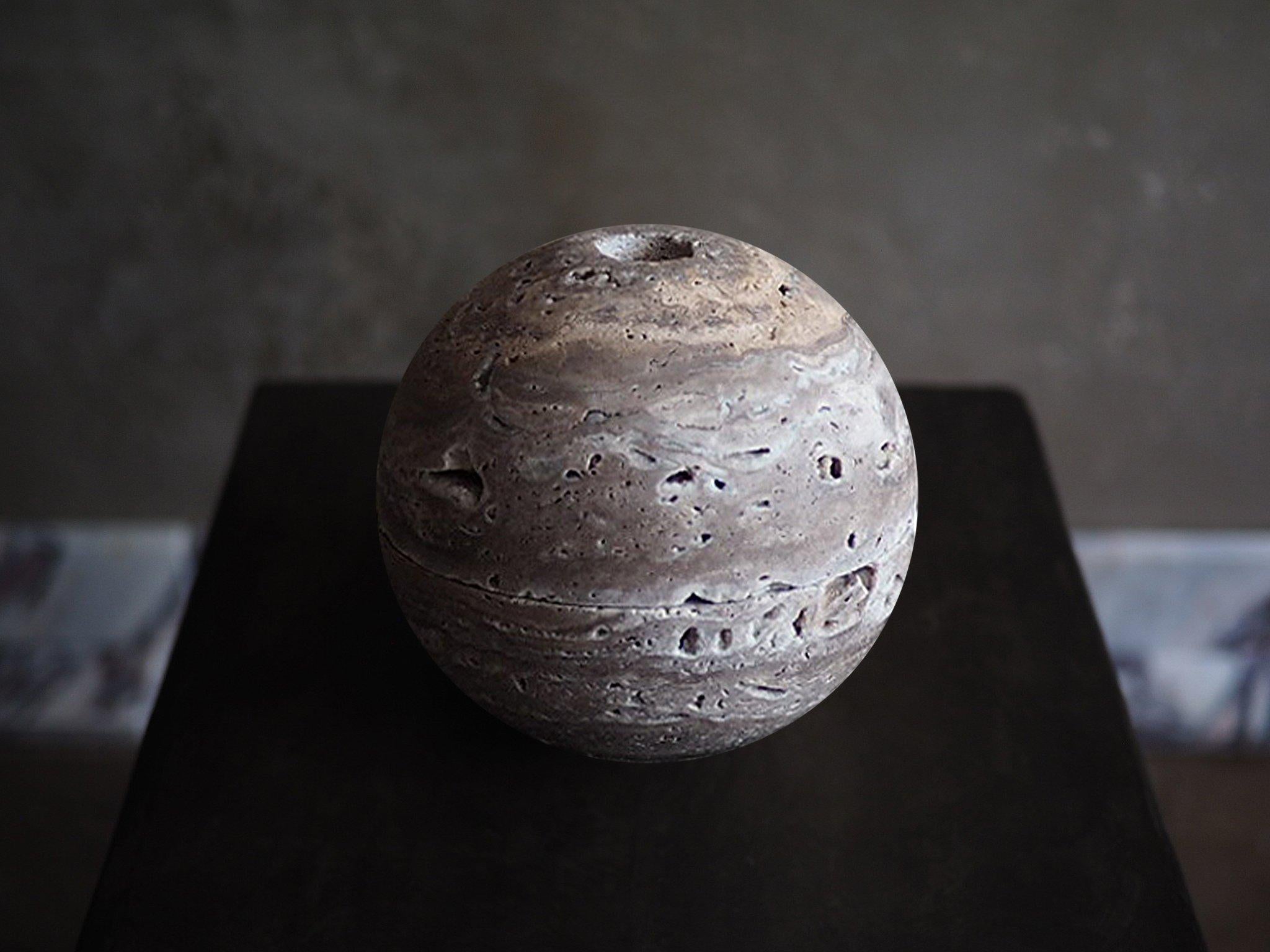 Sculpted from solid blocks of unfilled beige travertine, sphere censer by Brendan Tadler. Minimalist in form, the sphere censer acts as a quiet object to stimulate creativity and focus when activated with incense or sage. Inside the sphere, burn