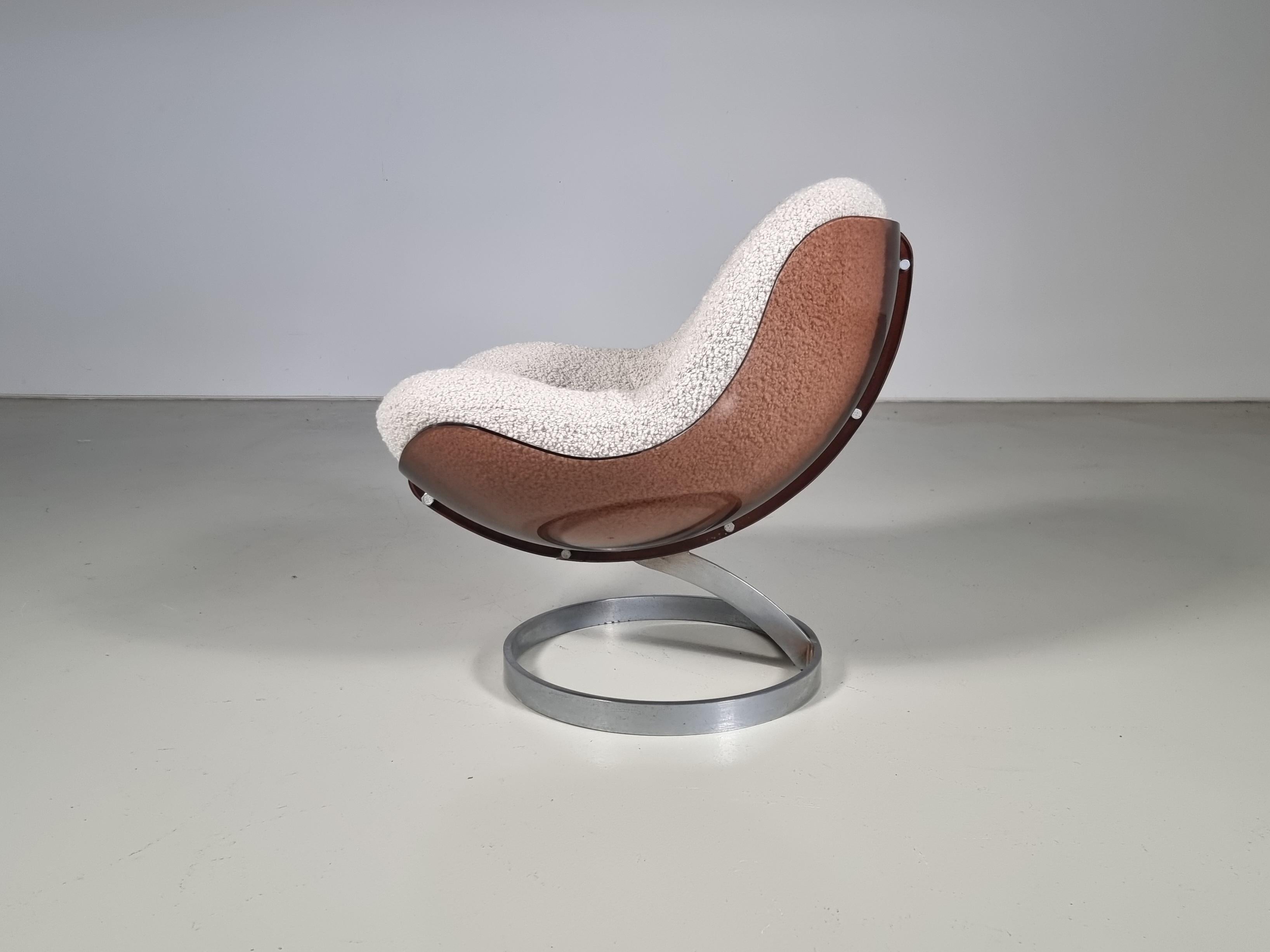 Rare ’Sphere’ lounge chair designed by Boris Tabacoff in 1971. Manufactured by the French MMM. factory (Mobilier Modular Moderne) It has a characteristic brown lucite shell that holds the original reupholstered bouclé cushion. The plexiglass shell