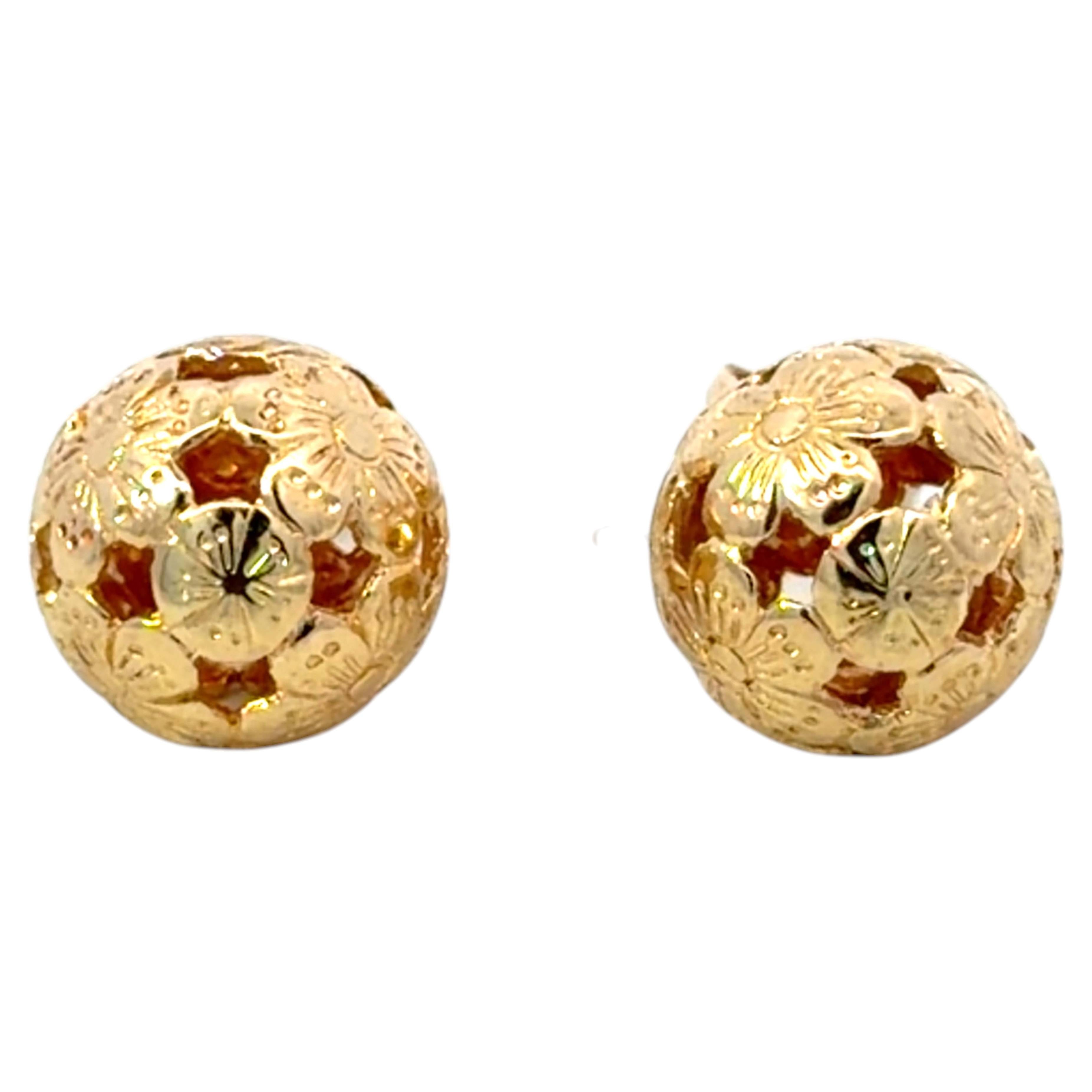 Orecchini con motivo a fiori ritagliati a forma di sfera in oro giallo 14 carati