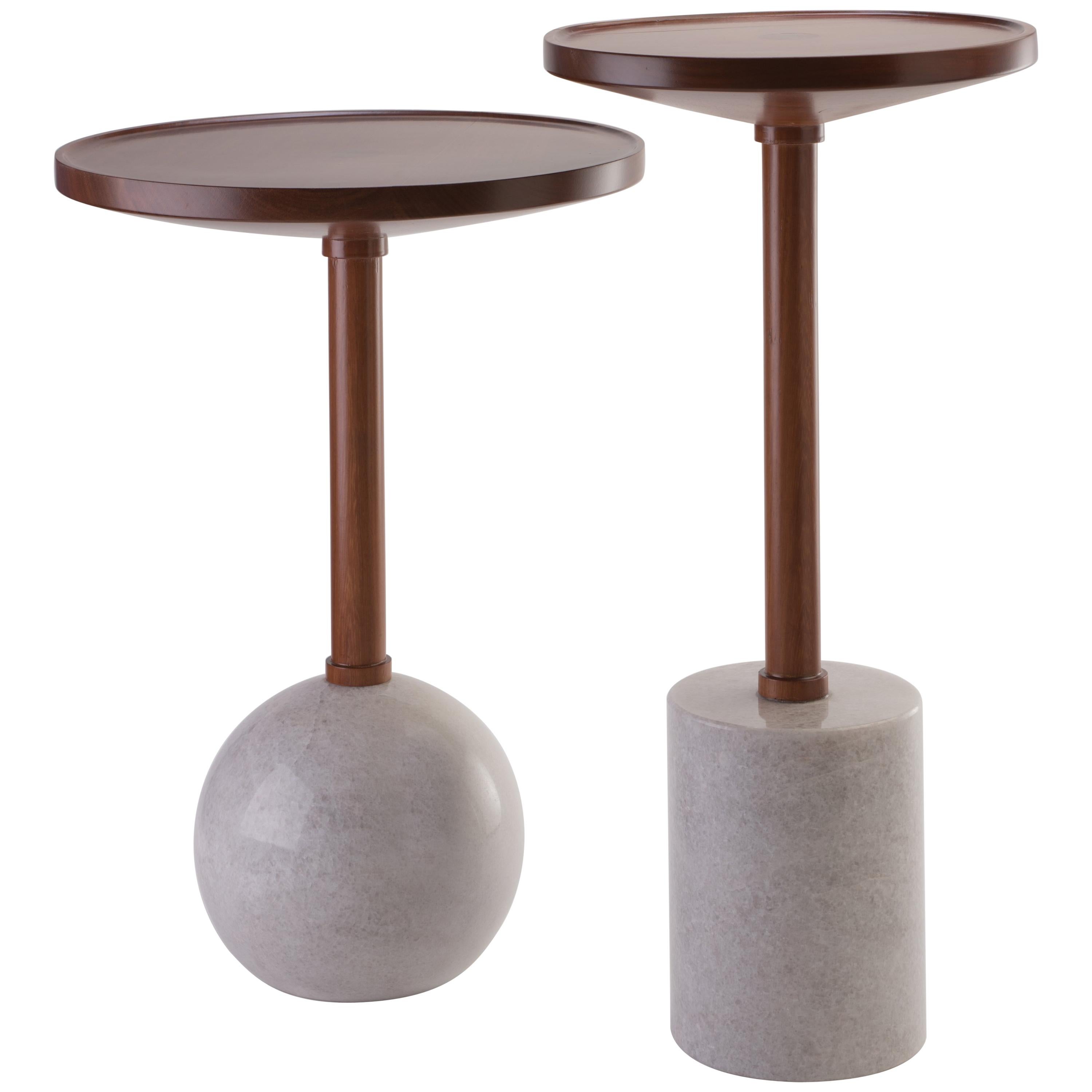 Honouring the process of craftsmanship, geometry makes poetry in the Mesas Monterrey. Both tables are turned by hand; the bases are made of a marble cylinder and sphere, the tops are made of solid tzalam wood in two different diameters. With