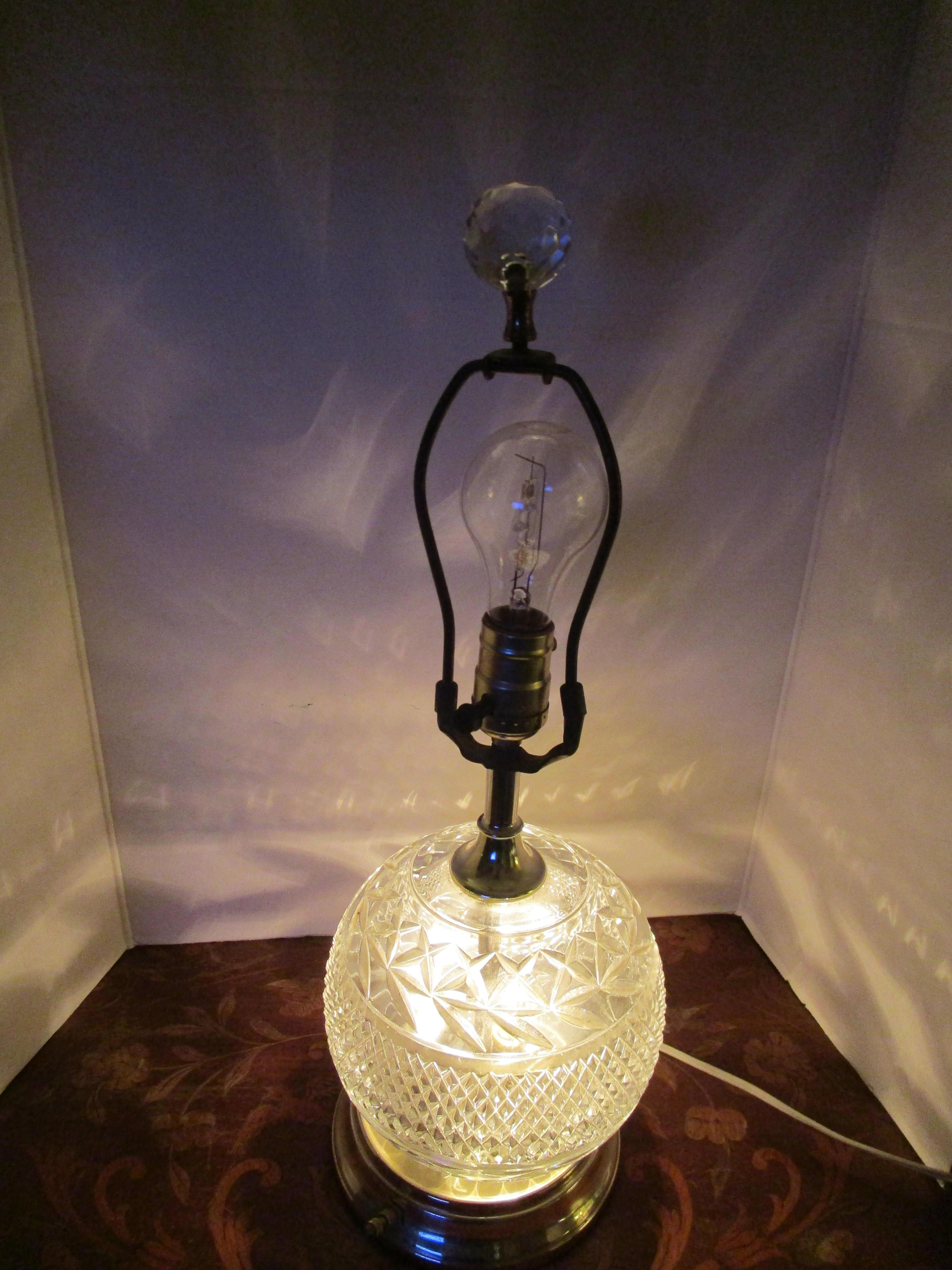 This little well-priced ode to art deco design is as functional as it is attractive. The lamp is on a three-way switch that lights the base, the bulb or both at one time. The cut crystal motifs that decorate the lamp is beautiful on the crystal ball
