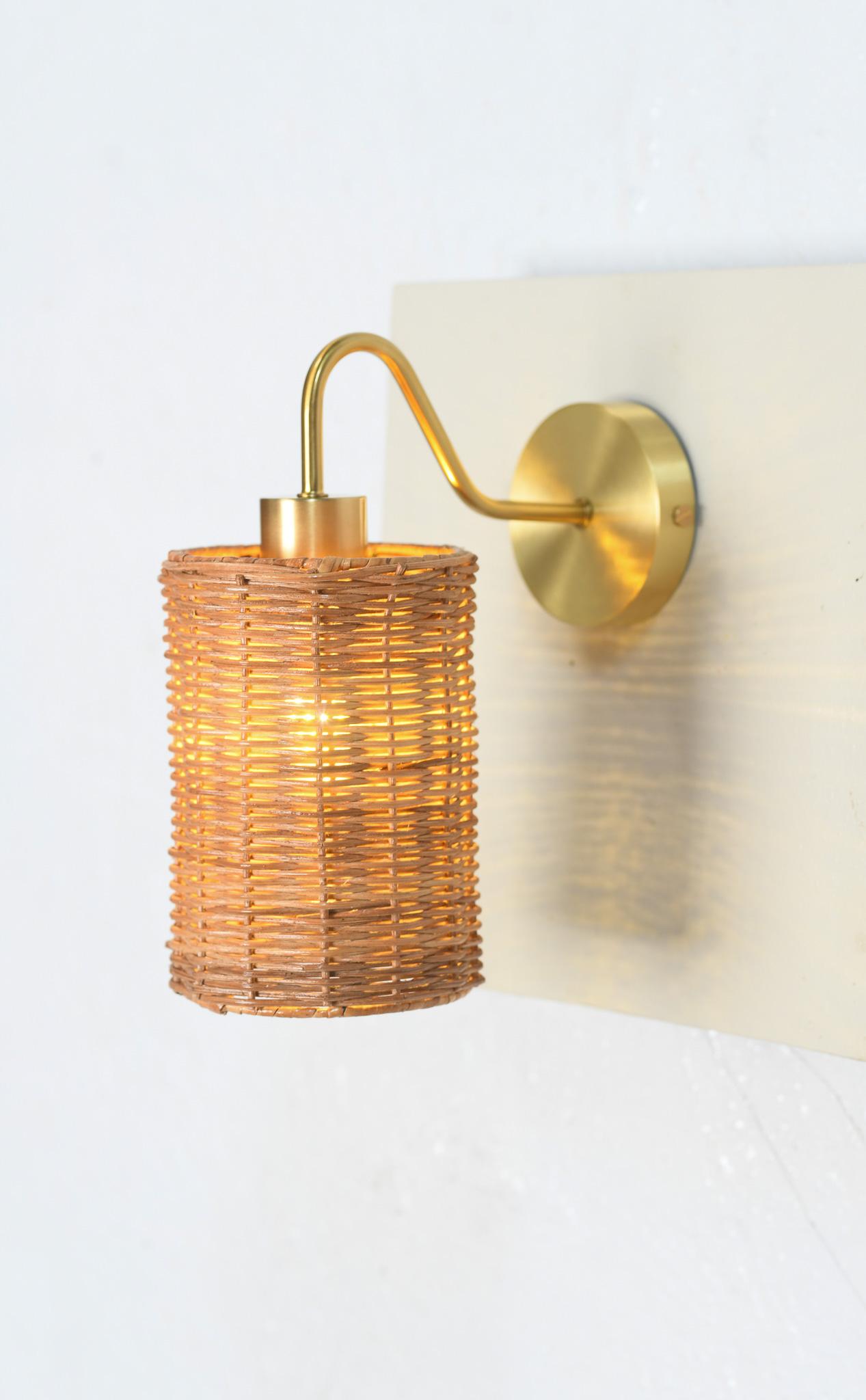 This exquisite Sphere Shaped Wicker & Brass Wall Sconce—a masterpiece of artisanal craftsmanship that brings warmth and character to any room. Each sconce is meticulously handwoven using natural wicker, creating an organic texture that catches and