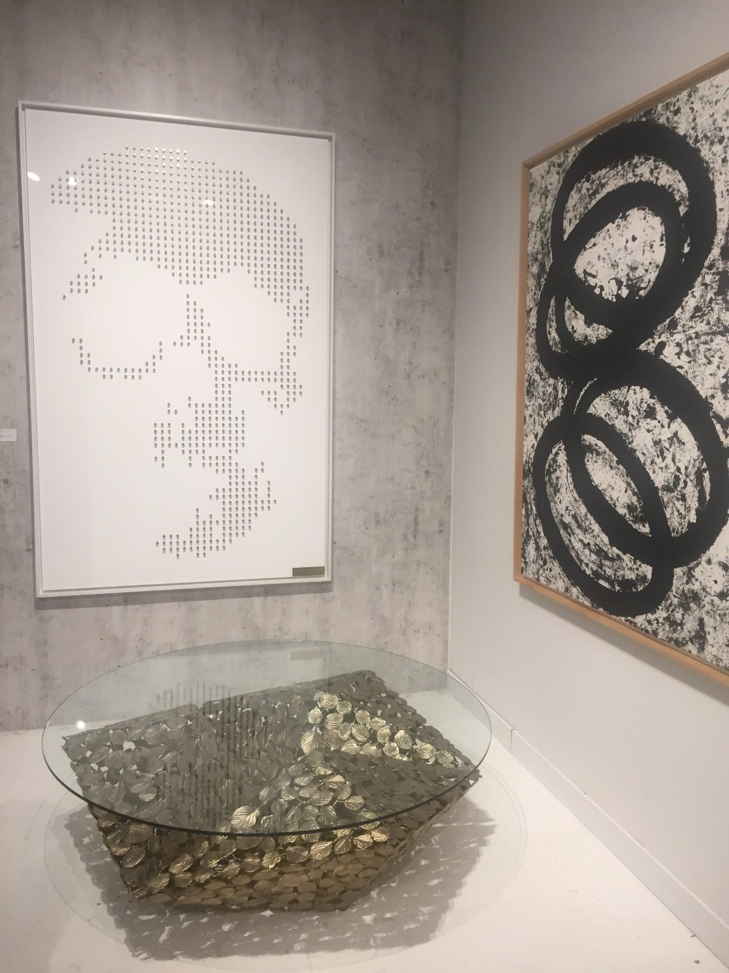 Stellated Spherical Spring Table is a unique and artistic table, that was featured at Salon NYC. Made to order the artist casts thousands of bronze winter hazel leaves ,or ginko leaves ( not shown) and welds and assembles a unique embellished