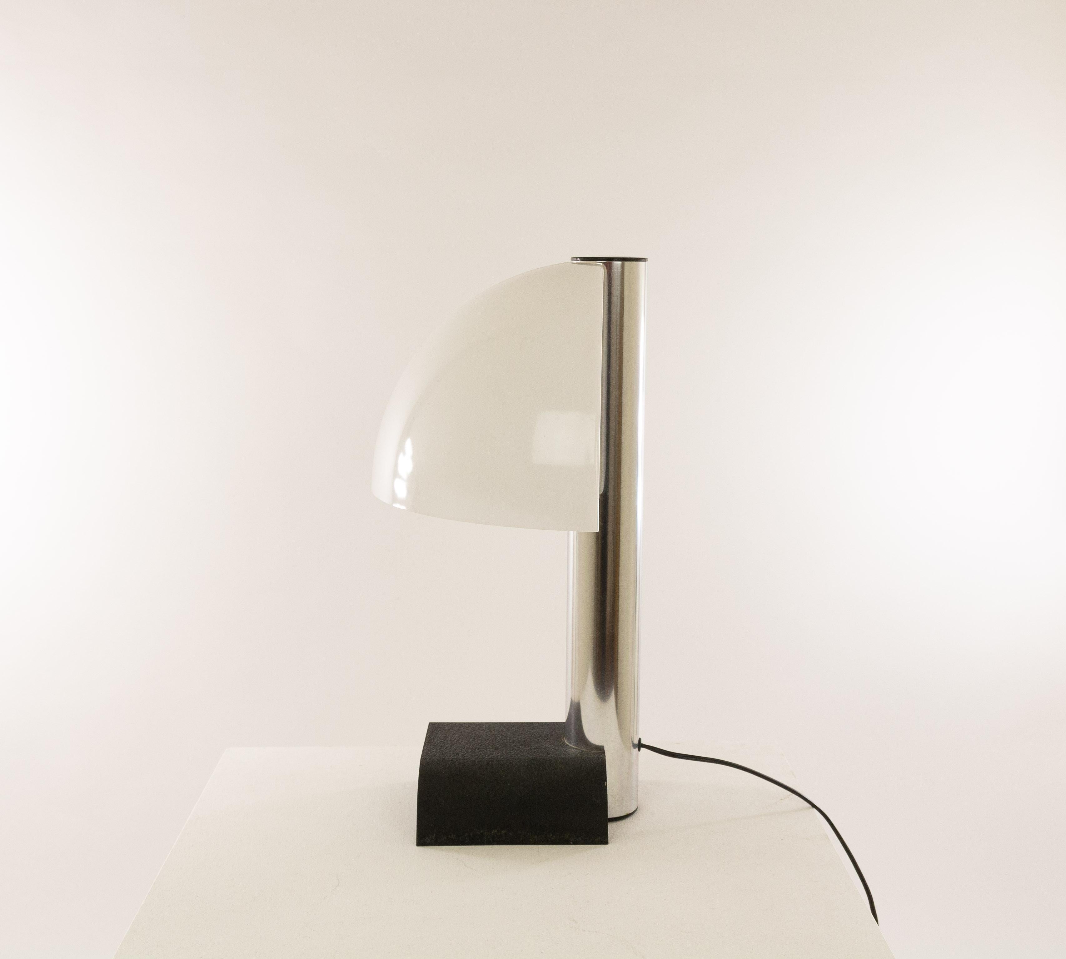 Spicchio table lamp designed by Danilo and Corrado Aroldi and manufactured by Stilnovo in 1972.

Danilo and Corrado Aroldi designed a whole range of Spicchio lamps for Stilnovo. In our archive we found 3 different wall lamps, 2 pendants, a floor