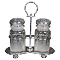 Juego de especias en metal plateado y cristal, S. XIX.