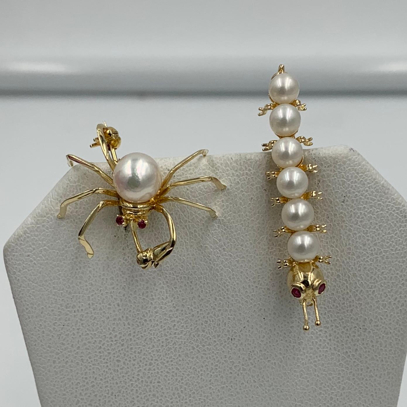 A wonderful pair of Pearl and Ruby Insect Brooch Pins in the form of a gorgeous Spider and a delightful Caterpillar in 14 Karat Gold.  The magnificent Spider has an 8mm silvery white Pearl for its body and sparkling Ruby Eyes.  The long legs are 14
