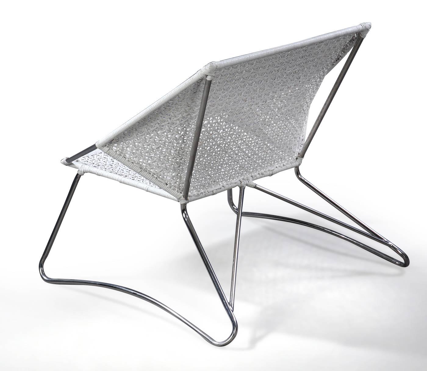 Armchair with stainless steel structure, white weave. 
Measure: H 74/35, B 89, D 75 cm.