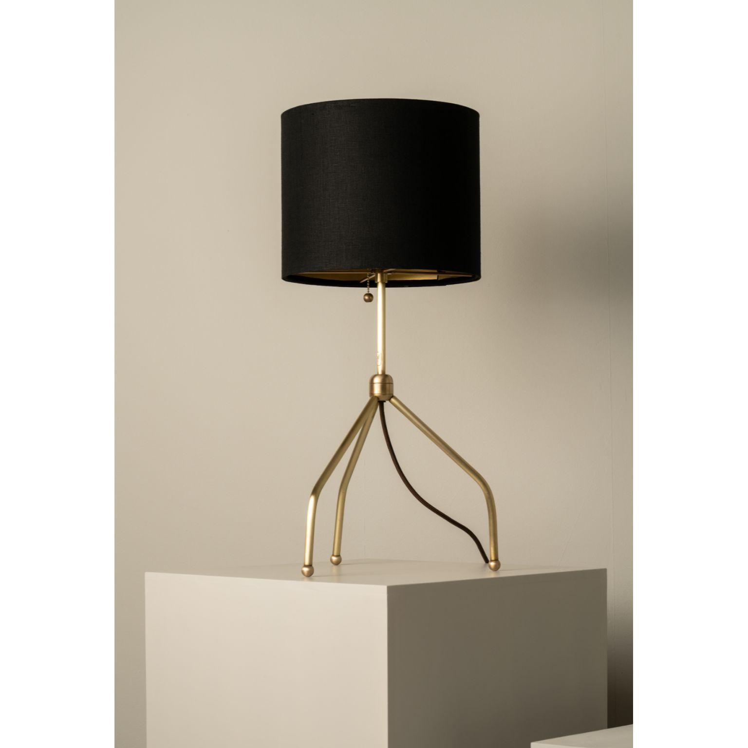 Spider Long Legs Table Lamp by Isabel Moncada
Dimensions: Ø 35.5 x H 66 cm.
Materials: Forged and brushed brass and linen-lined fiberglass lampshade.

An elegant lamp that gently blends with its surroundings and brings a touch of brightness with its
