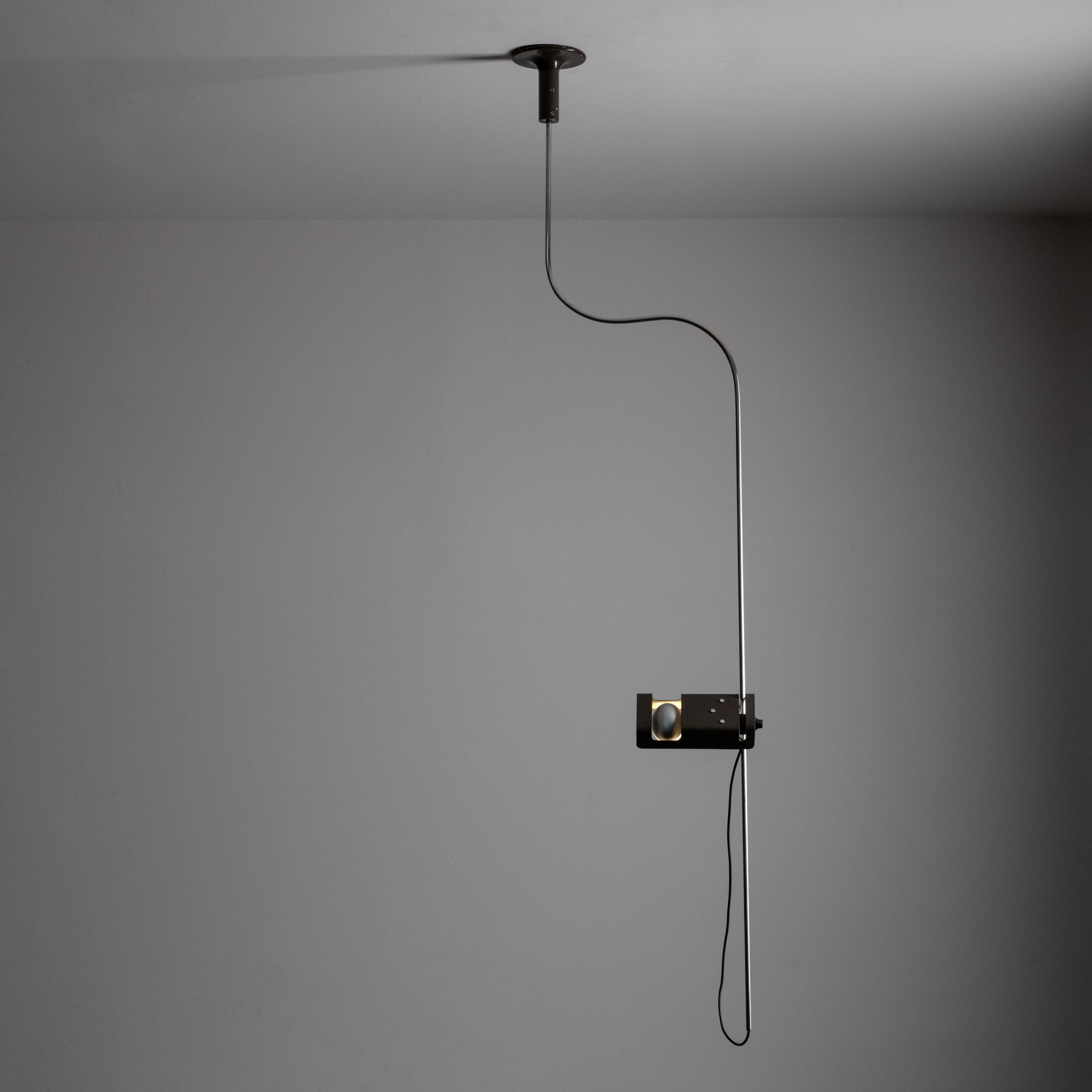 “Spider” pendant by Joe Colombo for Oluce. Designed and manufactured in Italy, 1965. Enameled metal, chrome. Rewired for US standards. Bulb(s) not included. 
We recommend one Bayonet euro socket with converted G9 adaptor bulb. Bulb included with