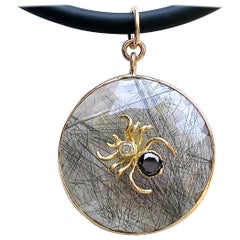Spider Pendant in Yellow Gold with Black and White Diamonds on Rutilated Quartz
