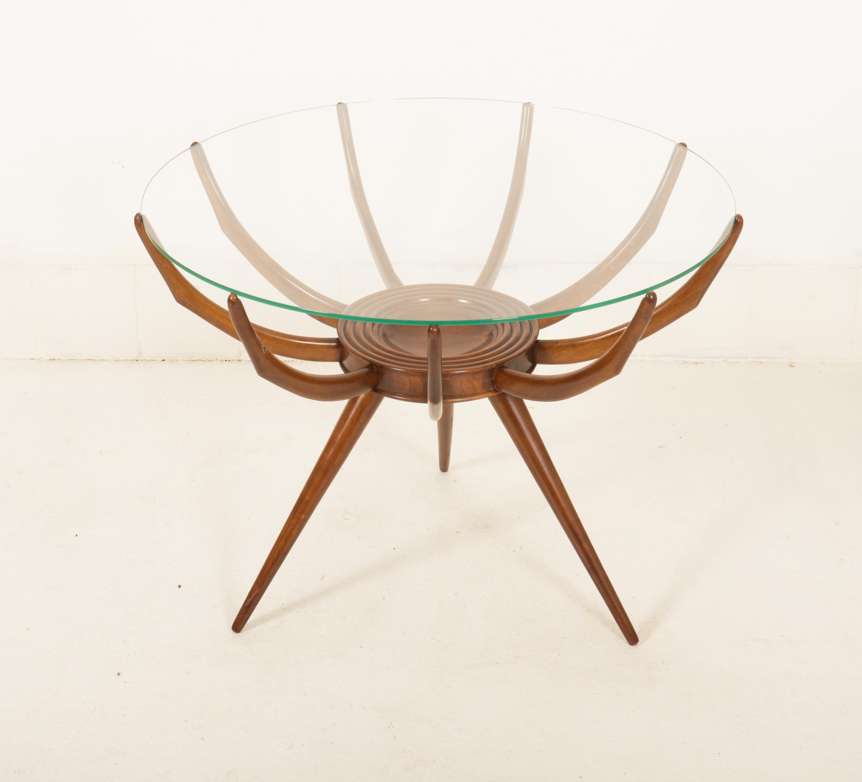 Wooden walnut frame base and round transparent glass top designed in the 1950s by Carlo De (di) Carli. Named als 