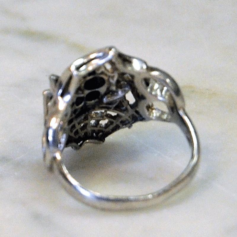 A special and rare silver ring with a silver spider climbing up on a spiderweb. Marked with O2. Probably Scandinavian.
Inner diameter is 18 mm, height of ring 22 mm. Length of spider 24 mm. Weight: 0 gram. Condition as in the pictures is
very good,