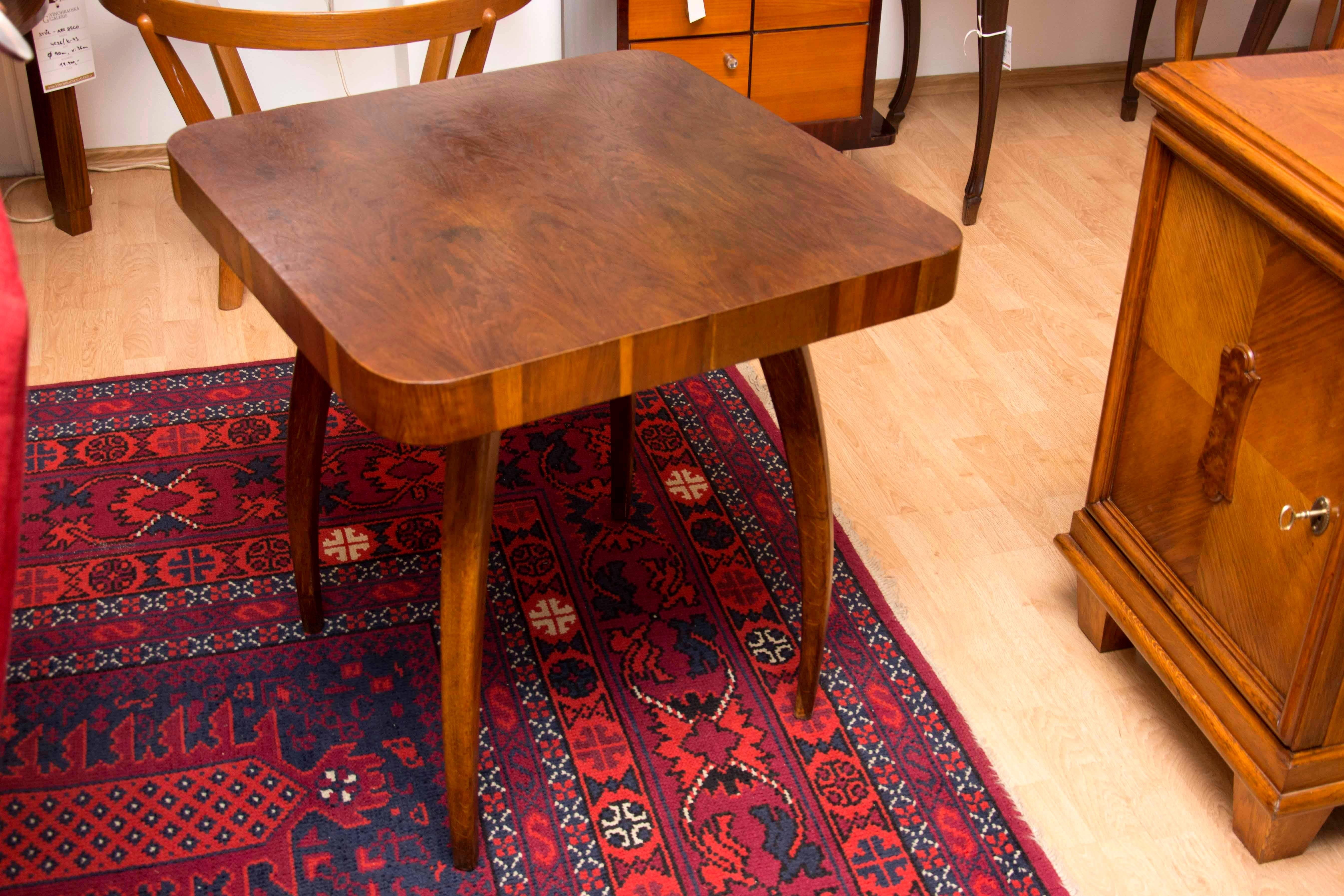 This oak table called spider was designed by the world famous architect Jindrich Halabala under catalog No. H-259 in the 1950s. Unique style of this table is recognized all-over the world. The table stands on four legs of bentwood. Massive top board