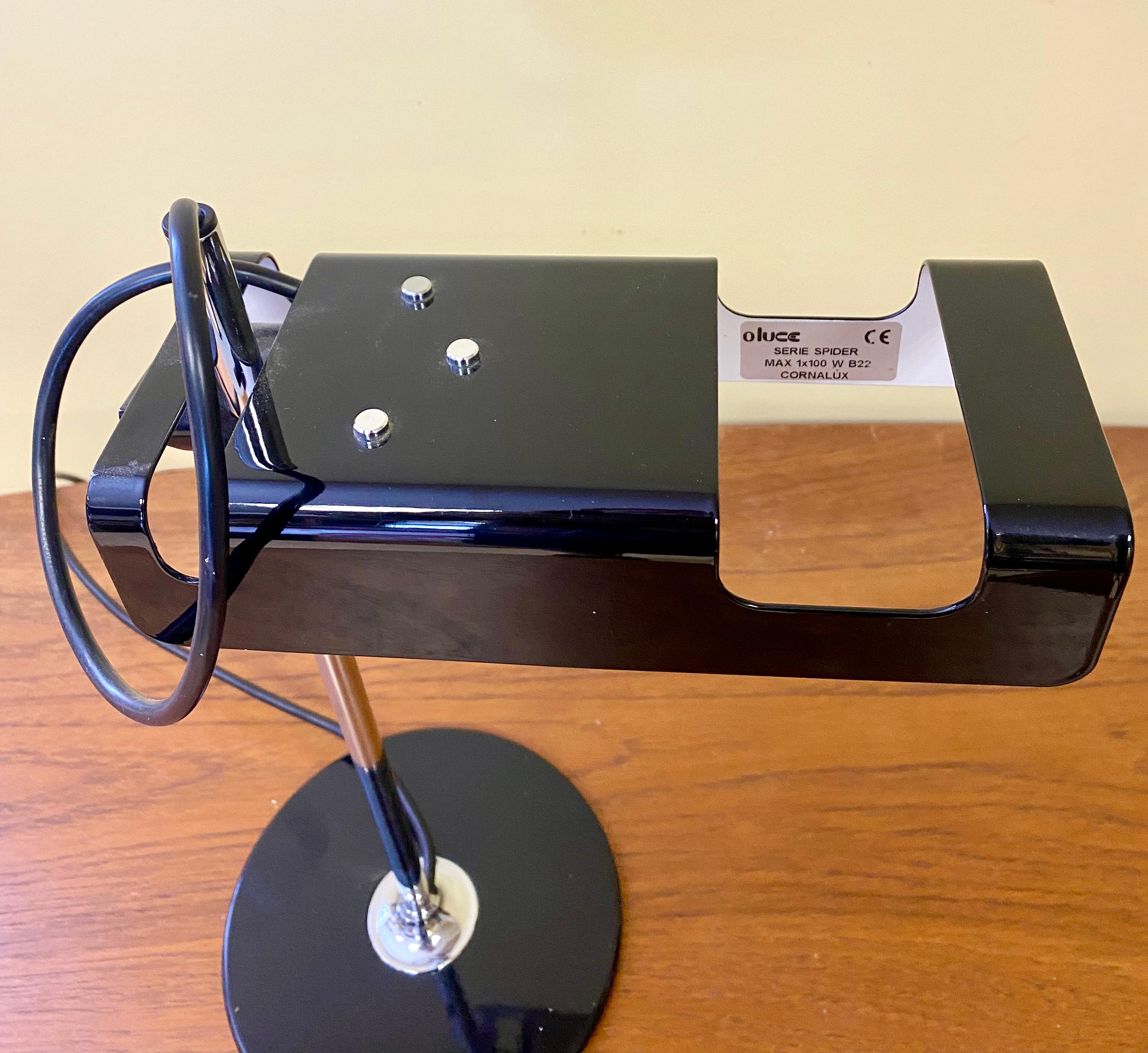 The Spider table lamp was designed by Joe Colombo in 1965. Lacquered metal base, chromium-plated stem, adjustable reflector in lacquered aluminum. Manufactured by Oluce, Italy.  Fine vintage condition without scratches or dents. Fully functional but