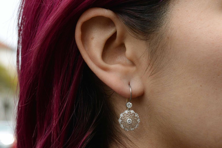 The lacy filigree and feminine milgrain of these Edwardian or Art Nouveau inspired drop earrings are incredible. The spider web has 