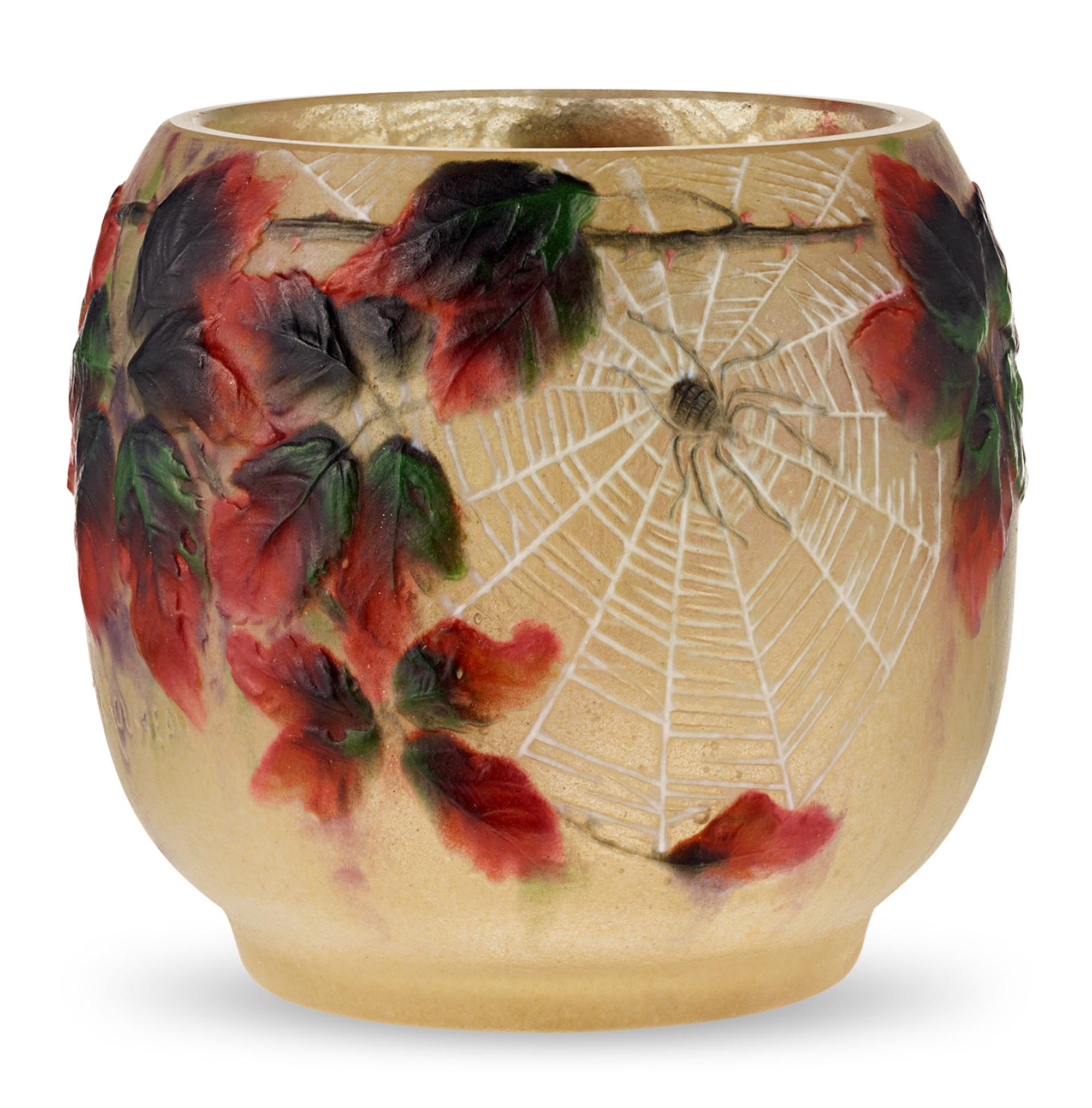 This highly rare and whimsical vase comes from the creative mind of Gabriel Argy-Rousseau, a celebrated Art Nouveau glassware designer and pioneer of the pâte de verre technique. Featuring the molded reliefs of spiders spinning webs amongst tangled
