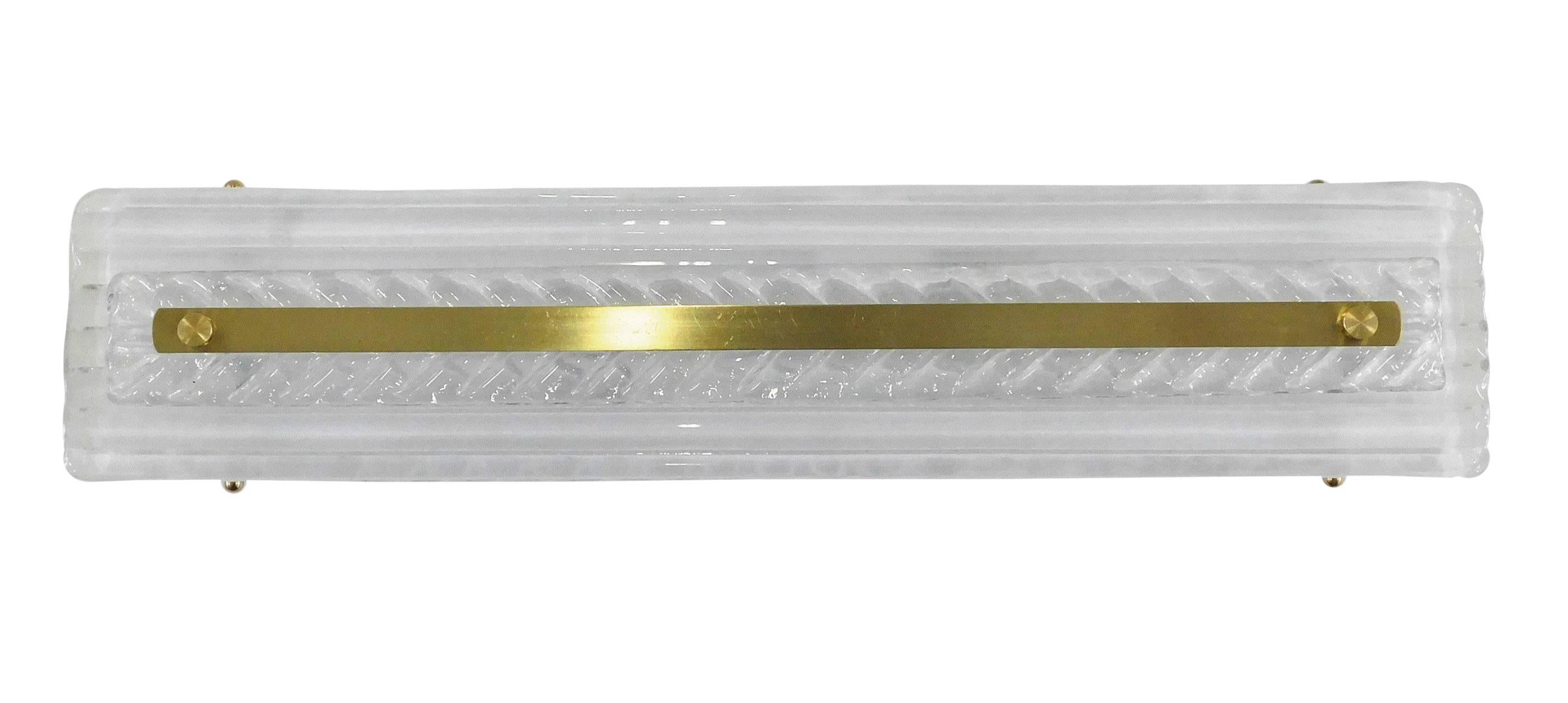 Italian wall light or flush mount shown in clear Murano glass with herringbone / chevron pattern and polished brass details / Designed by Fabio Bergomi / Made in Italy
2 lights / E12 or E14 type / max 40W each
Height: 25 inches / Width: 5 inches /