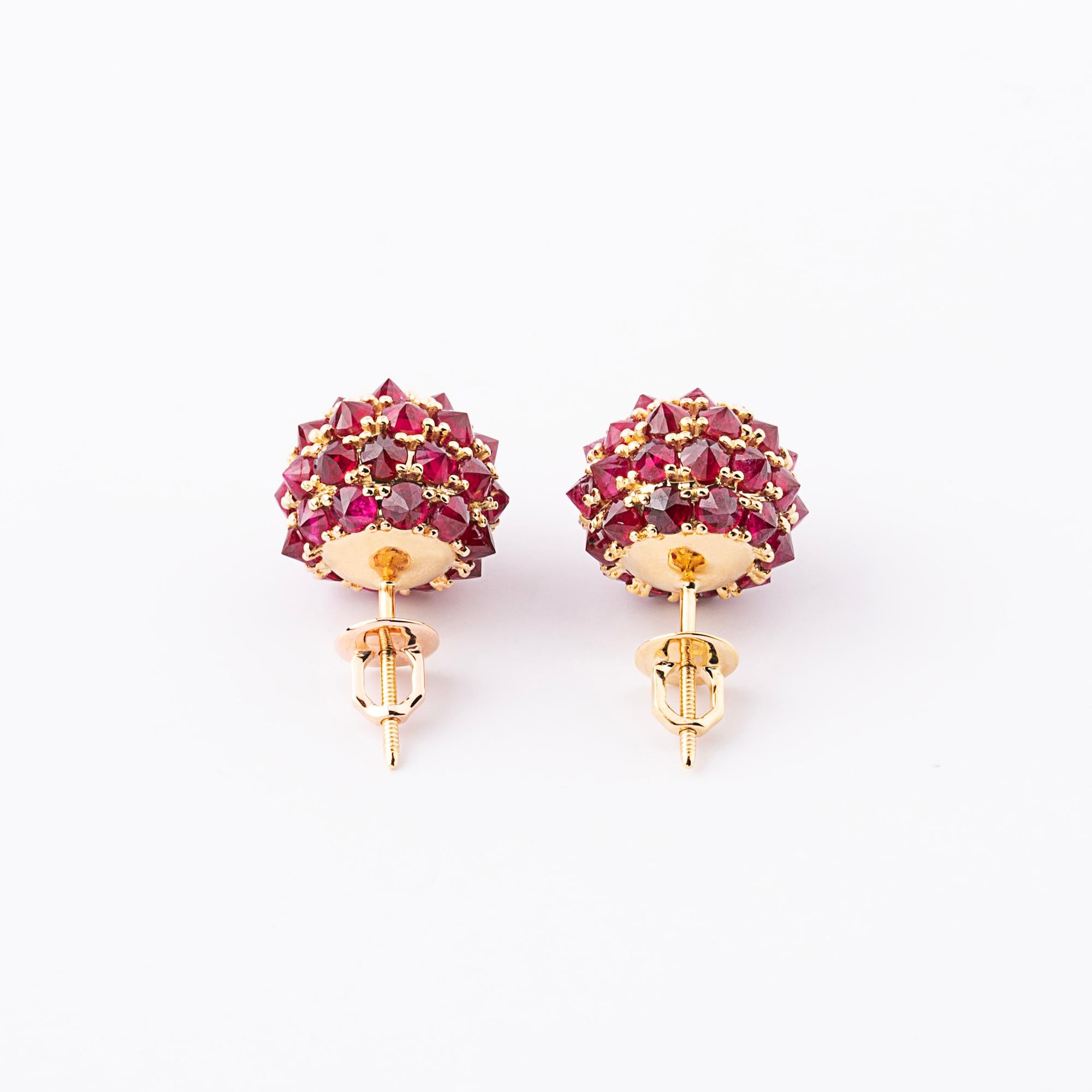 Blood red ruby earrings in 18k gold. Over 8 ct. natural specially cut 2.7mm wide brilliant rubies cover the face of 18k gold balls. The earrings have screw backs. Total gold weight 9 grams. 
Each spike ball is 1.4 cm wide (14mm diameter). 

The