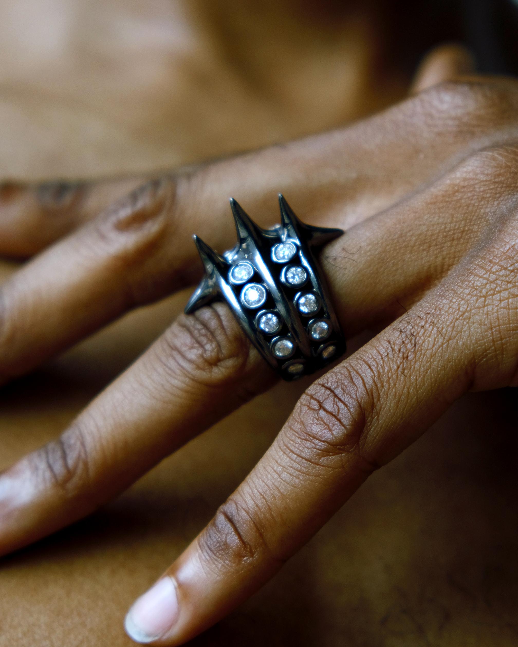 A spiked ring and a meditation on the central role that communities play in protecting the things they value. Rendered in 18k gold coated with black rhodium and set with diamonds. 


This item is produced made-to-order and has a 3-6 week production