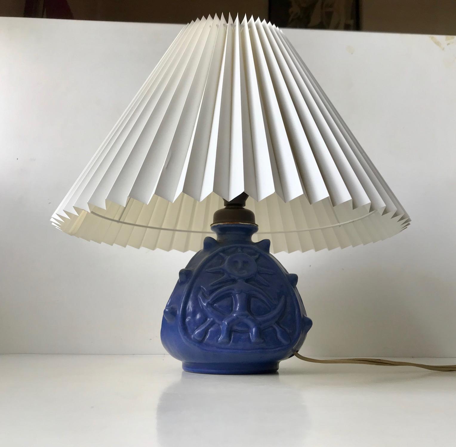 Blue glazed spiky ceramic table lamp with two sides with troll motifs. Designed and manufactured by Lauritz Hjorth on the Island of Bornholm in Denmark around 1940. Please provide your own shade as the one in the picture is a model shade only. The