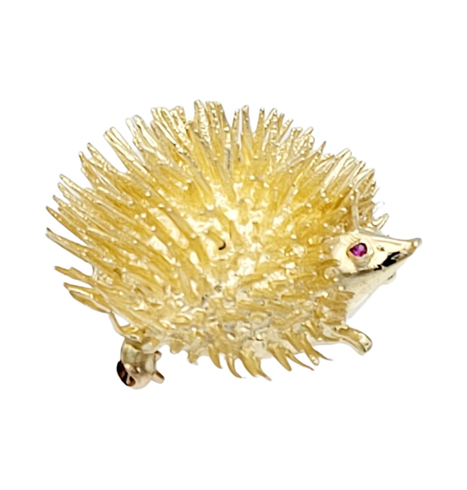 Contemporary Spiky Round Hedgehog Brooch with Ruby Eyes Set in 14 Karat Yellow Gold For Sale