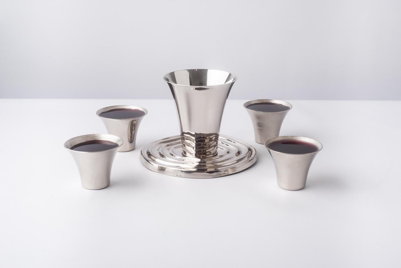 Elevate your home bar with this exquisite set of four Spill hand-spun cups, crafted from lustrous nickel-plated brass. The perfect choice for sampling premium spirits or indulging in elegant cocktails, these Spill cups exude sophistication and