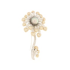 Brilliant white gold flower brooch and Tahiti pearl