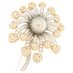 Brilliant white gold flower brooch and Tahiti pearl