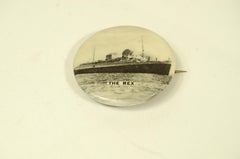 Lithographed sheet metal pin depicting the 1935 REX Transatlantic liner