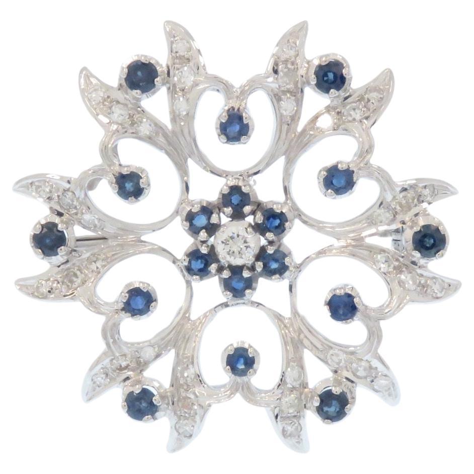 Broche  en or blanc avec diamants et saphirs bleus en vente